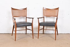 Paul McCobb for Directional Sculpted Walnut Cane Back Armchairs, Pair