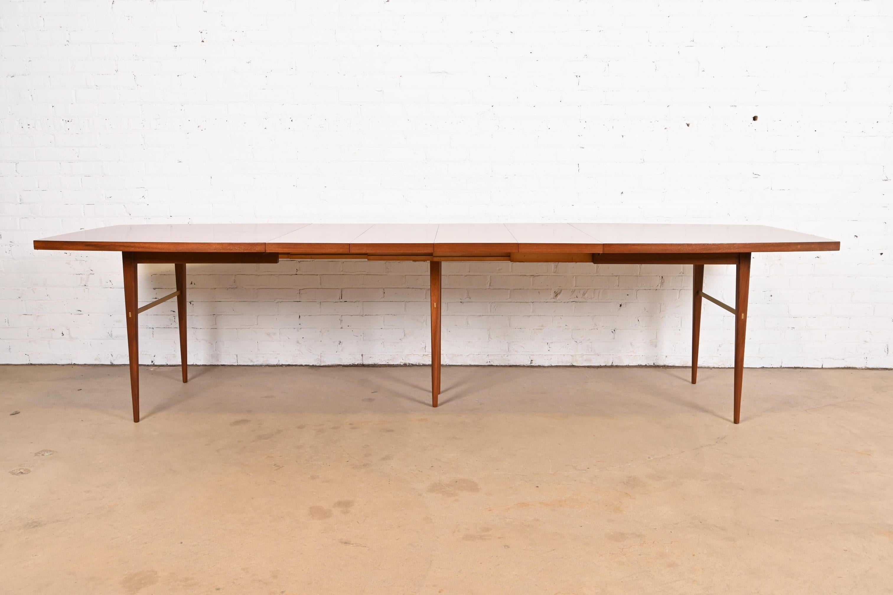 Paul McCobb for Directional Walnut and Brass Boat-Shaped Extension Dining Table In Good Condition In South Bend, IN
