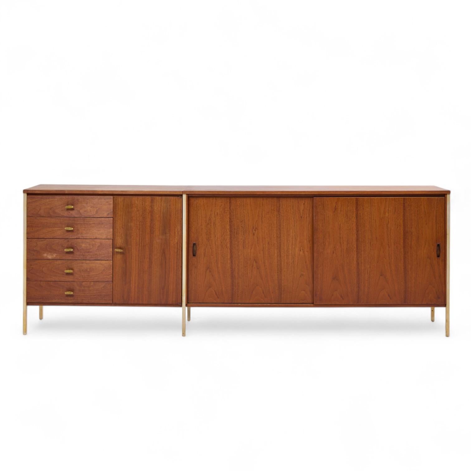 Paul McCobb for H. Sacks & Sons Connoisseur Collection Mid Century Walnut Credenza

This credenza measures: 98.5 wide x 18 deep x 34 inches high

All pieces of furniture can be had in what we call restored vintage condition. That means the piece is