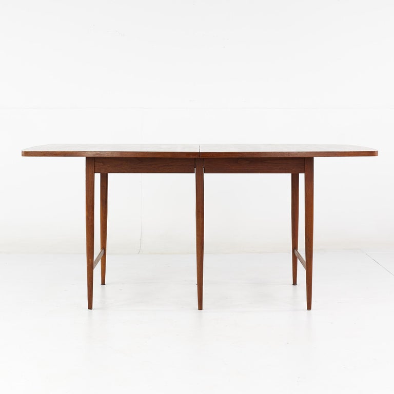 Paul McCobb for Lane Delineator mid century rosewood dining table with 3 leaves

This table measures: 66 wide x 38 deep x 29 high, with a chair clearance of 24.75 inches, each leaf is 12 inches wide making a maximum table width of 102 inches when