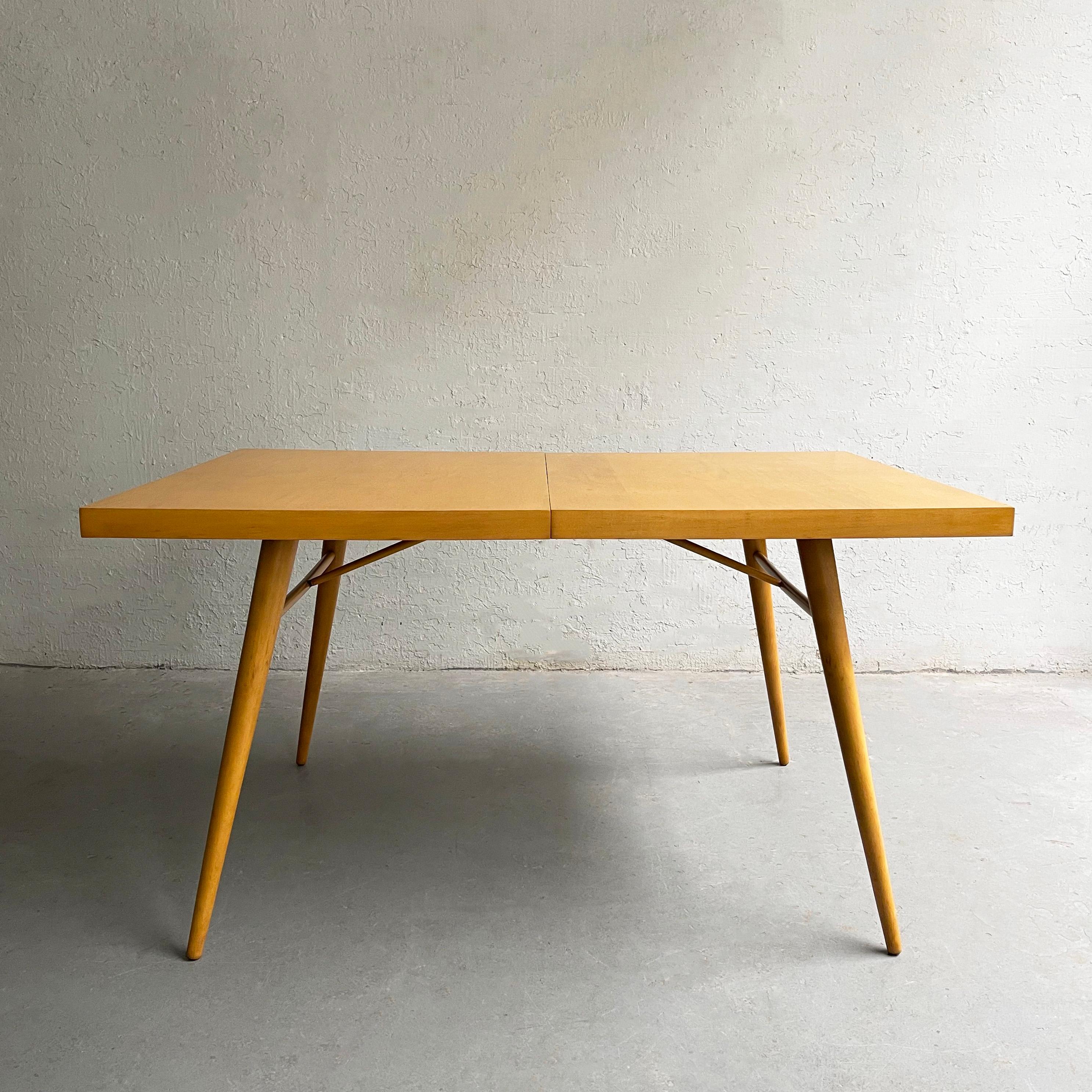 Model 1522, maple dining table by Paul McCobb for Planner Group, Winchendon, is iconic midcentury design that never goes out of style. The table can accept leaves but no leaves are present.