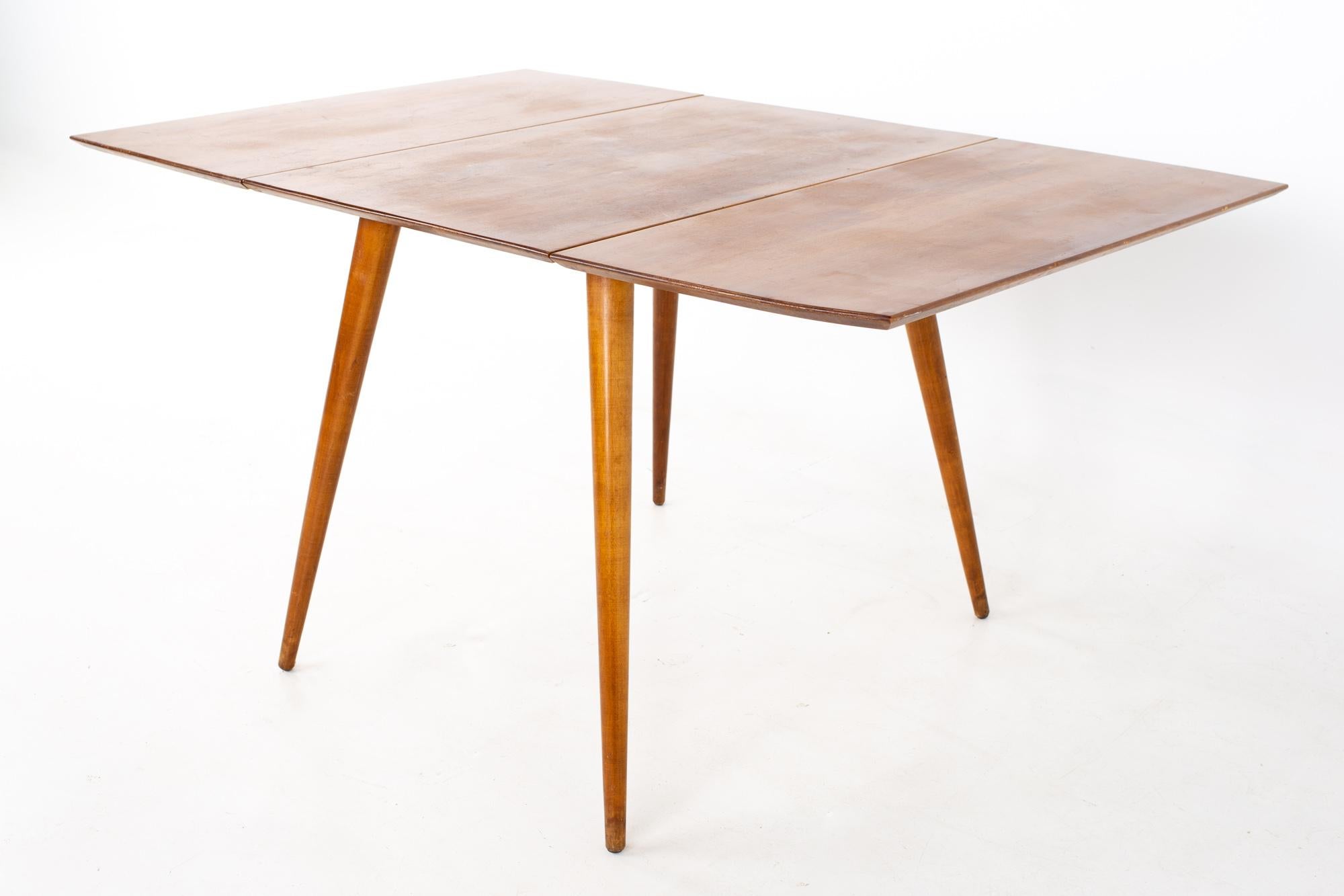 Paul McCobb for Planner Group mid century drop leaf dining table
Table measures: 23.25 wide x 36 deep x 29 inches high; each leaf is 17 inches wide, making a maximum table width of 57.25 when both leaves are used 

All pieces of furniture can be