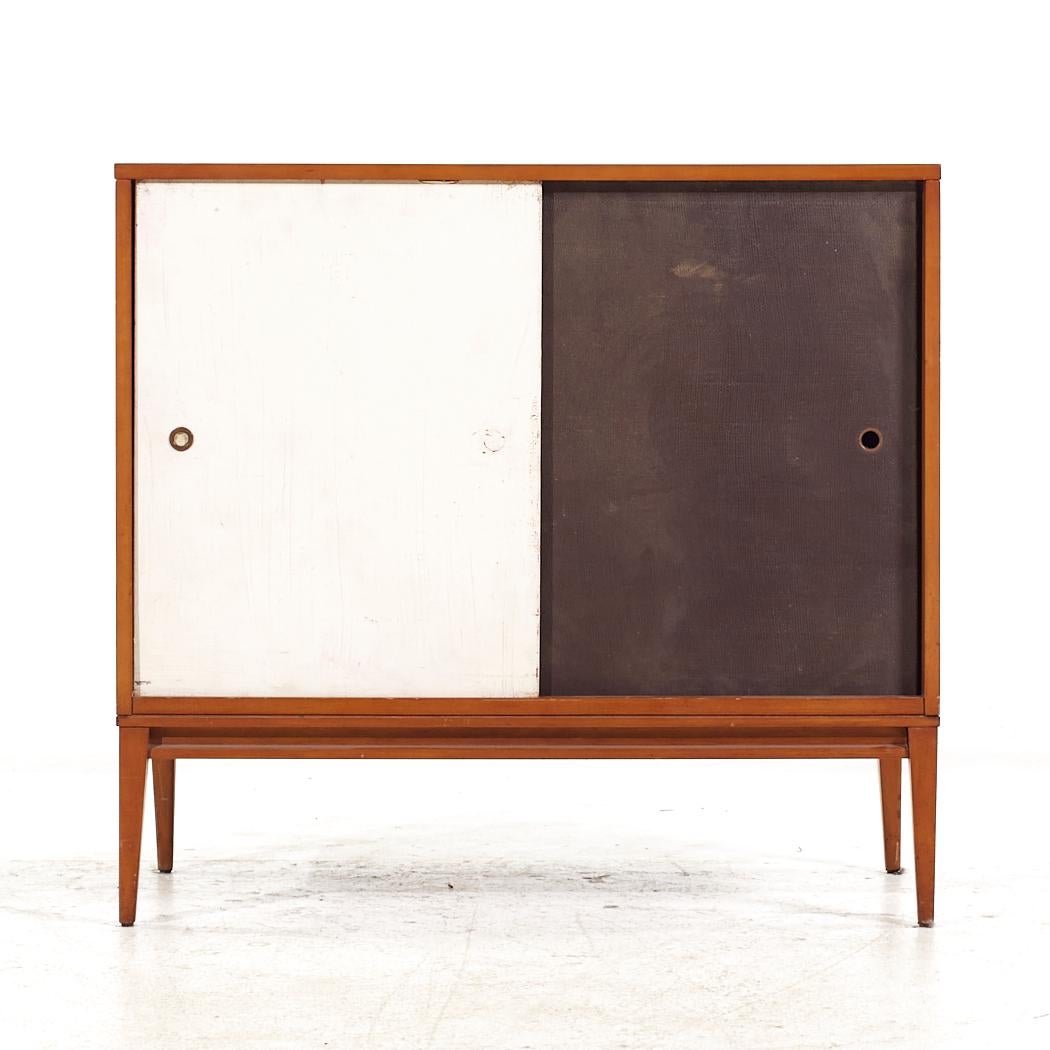 Paul McCobb for Planner Group Mid Century Sliding Door Cabinet

This cabinet measures: 36 wide x 18 deep x 33.5 inches high

All pieces of furniture can be had in what we call restored vintage condition. That means the piece is restored upon