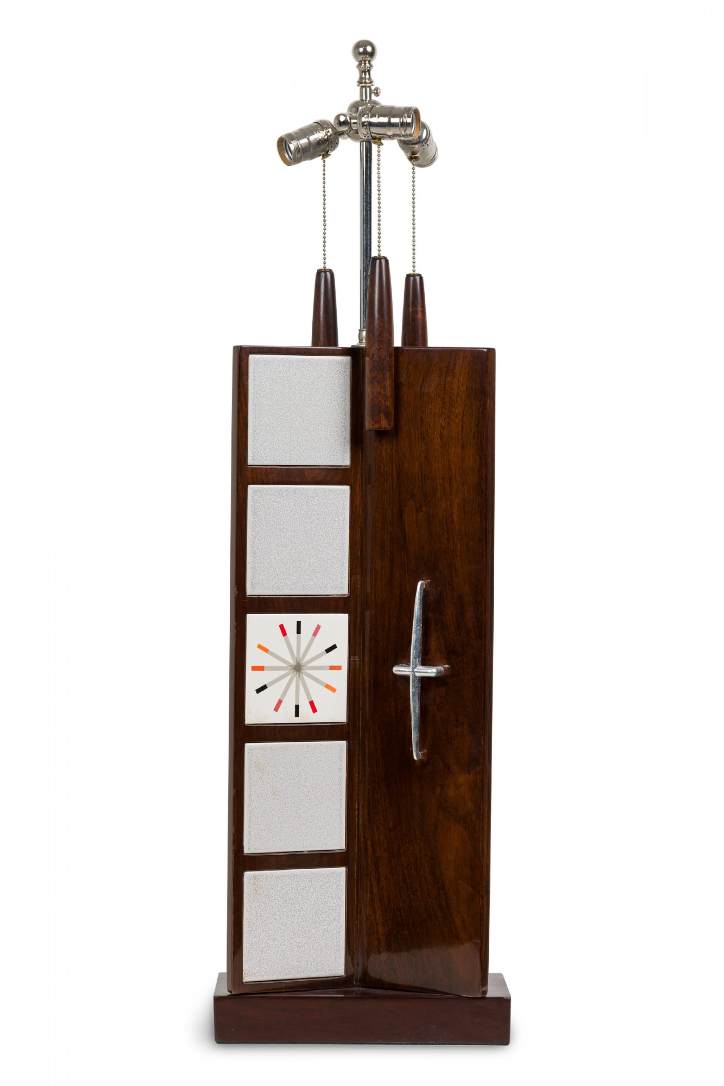 Mid-Century American (1950s) table lamp in triangular form from the Distinguished Designer Series featuring an extended silver metal stem plus three functioning light switch sockets and beaded tapered wood pulls, inlaid 