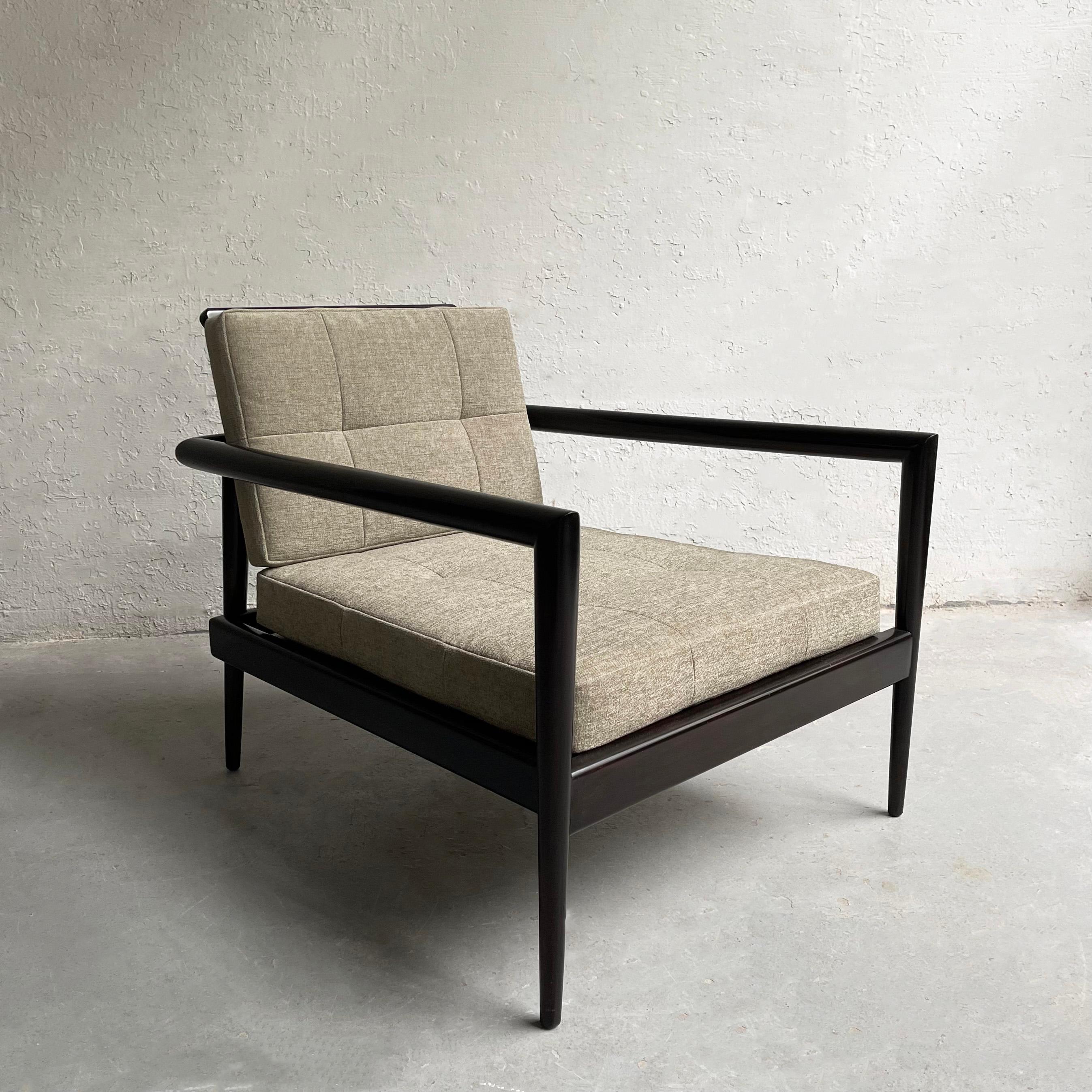 Mid-Century Modern, low profile, lounge chair by Paul McCobb for Winchendon features a deep seated, black lacquered maple frame with spindle back and newly upholstered cushions in segmented gray blue chenille.