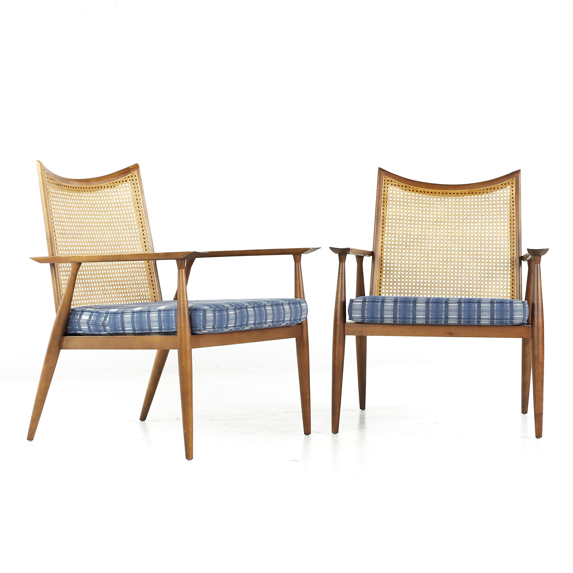 Paul McCobb for Winchendon midcentury cane and walnut lounge chairs - pair

Each chair measures: 26.25 wide x 25 deep x 33 inches high, with a seat height of 16.75 and arm height/chair clearance of 22.75 inches

All pieces of furniture can be