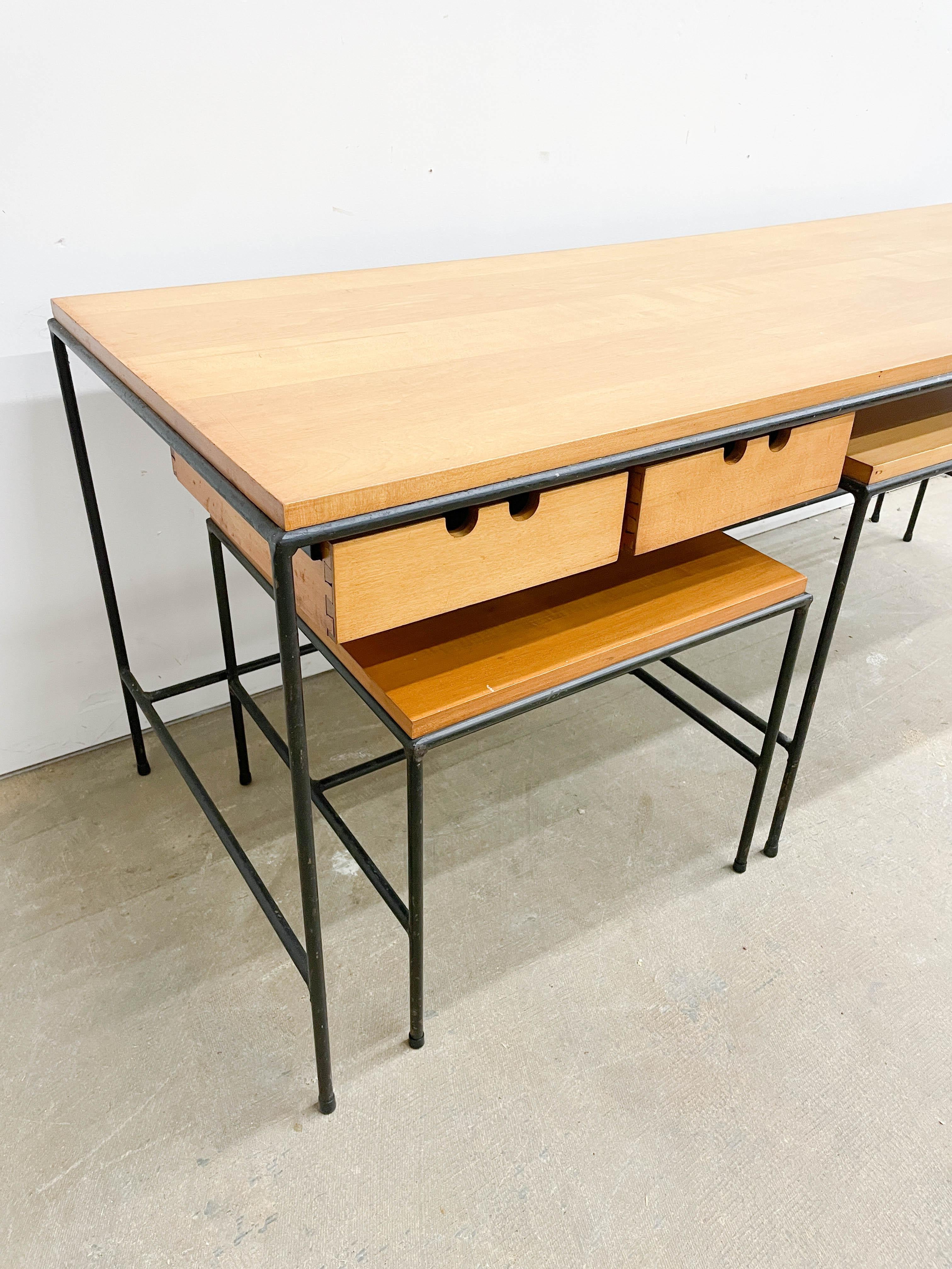 Stripped down minimalist nesting table designs from Paul McCobb's 1953 Planner Group. This set is extremely versatile and looks great while doing it. Featuring a main console table with two drawers, a smaller coffee table height unit and a square