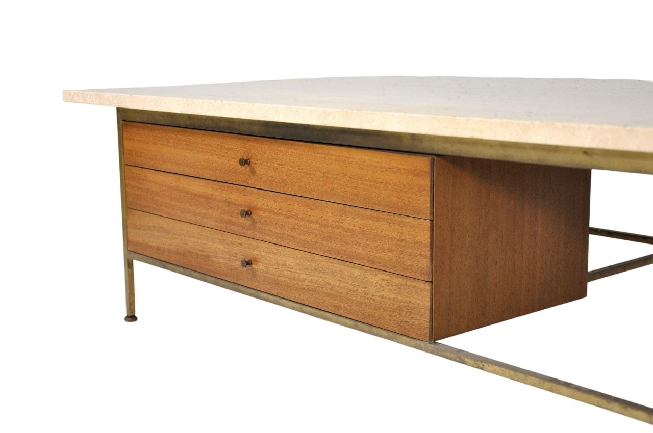 Large all original Paul McCobb mahogany and brass plateau table model 8705-L with travertine marble top from the Irwin Collection by Calvin Furniture. The Mid-Century Modern cocktail table features: rectangular Italian travertine top; three drawers