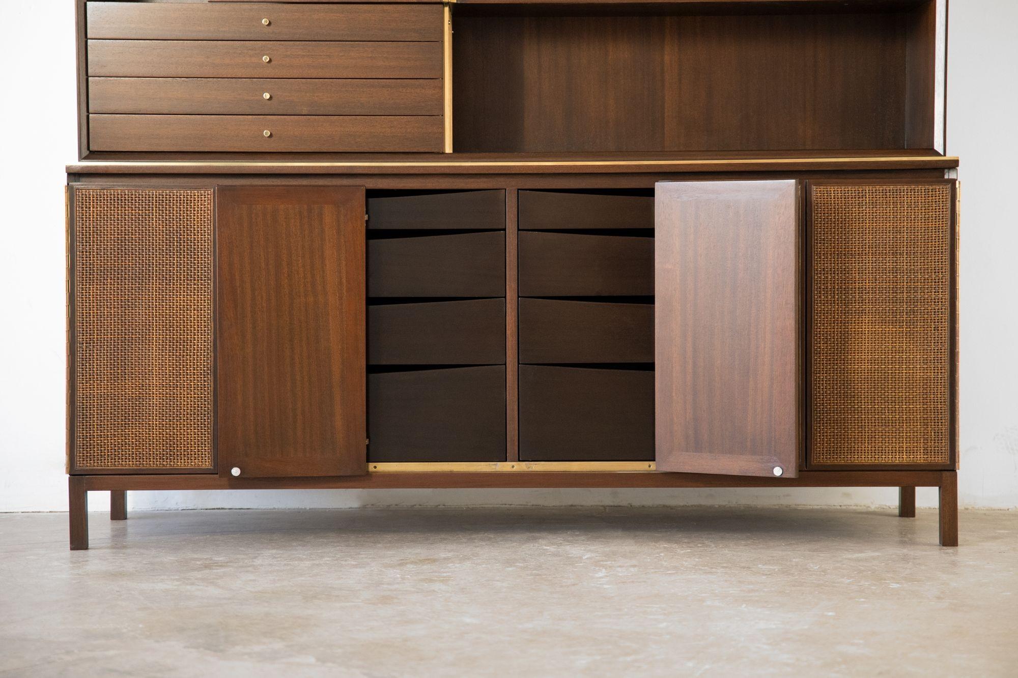 Extraordinary Paul McCobb Irwin Collection Sideboard featuring twelve drawers with cane front doors and display Shelf Model C8506 for Calvin 1952.
This is the ultimate storage and display system designed by McCobb for his illustrious Irwin