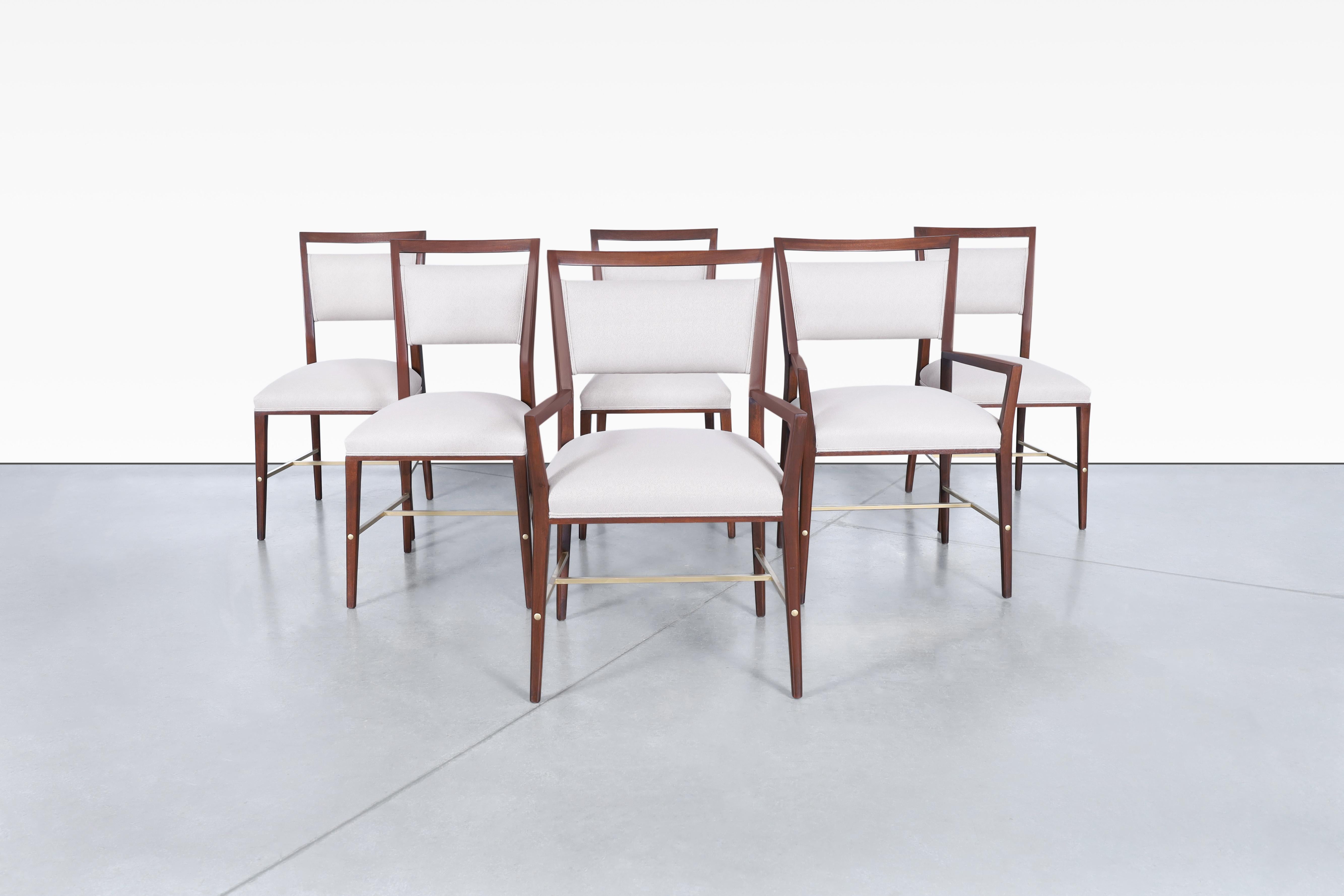 Introducing the exquisite vintage walnut dining chairs designed by Paul McCobb for Calvin Furniture in Grand Rapids, Michigan in the 1950s. Part of The Irwin Collection, these chairs are celebrated for their exceptional design and superior