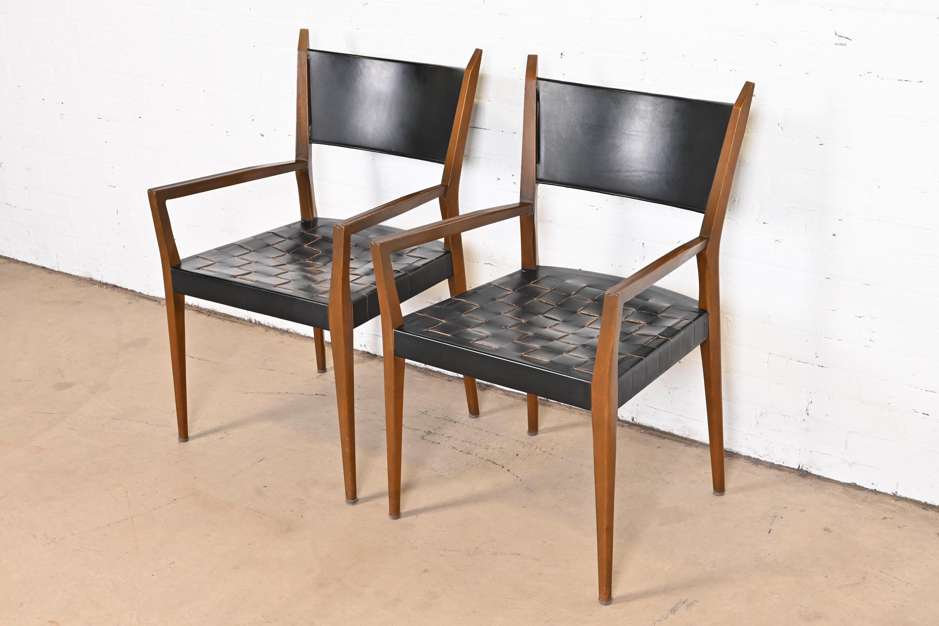 A sleek and stylish pair of Mid-Century Modern club chairs or dining armchairs

By Paul McCobb for Directional and produced by Calvin Furniture, 