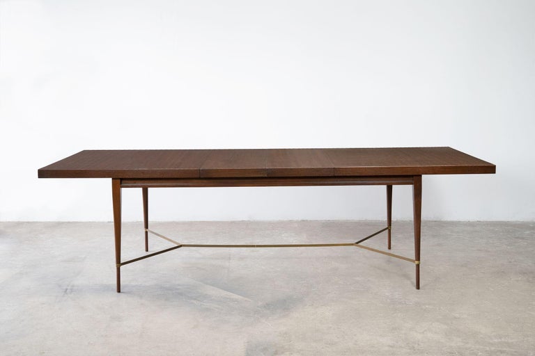 Mid-Century Modern Mahogany dining table conceived by world renowned interior designer Paul McCobb and produced by Calvin for the 
