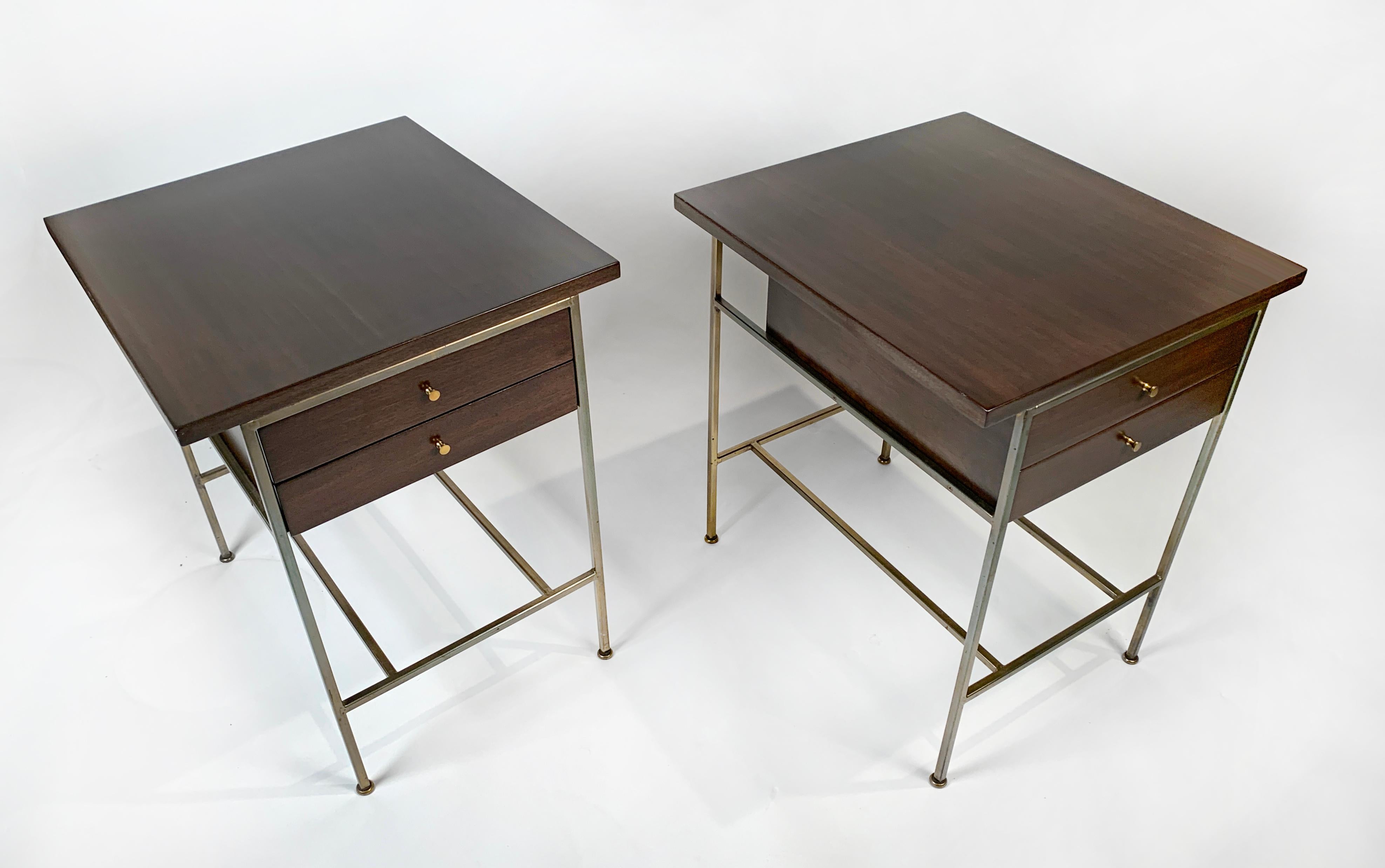 An early pair of Paul McCobb designed nightstands from his Irwin collection retaining the early 
