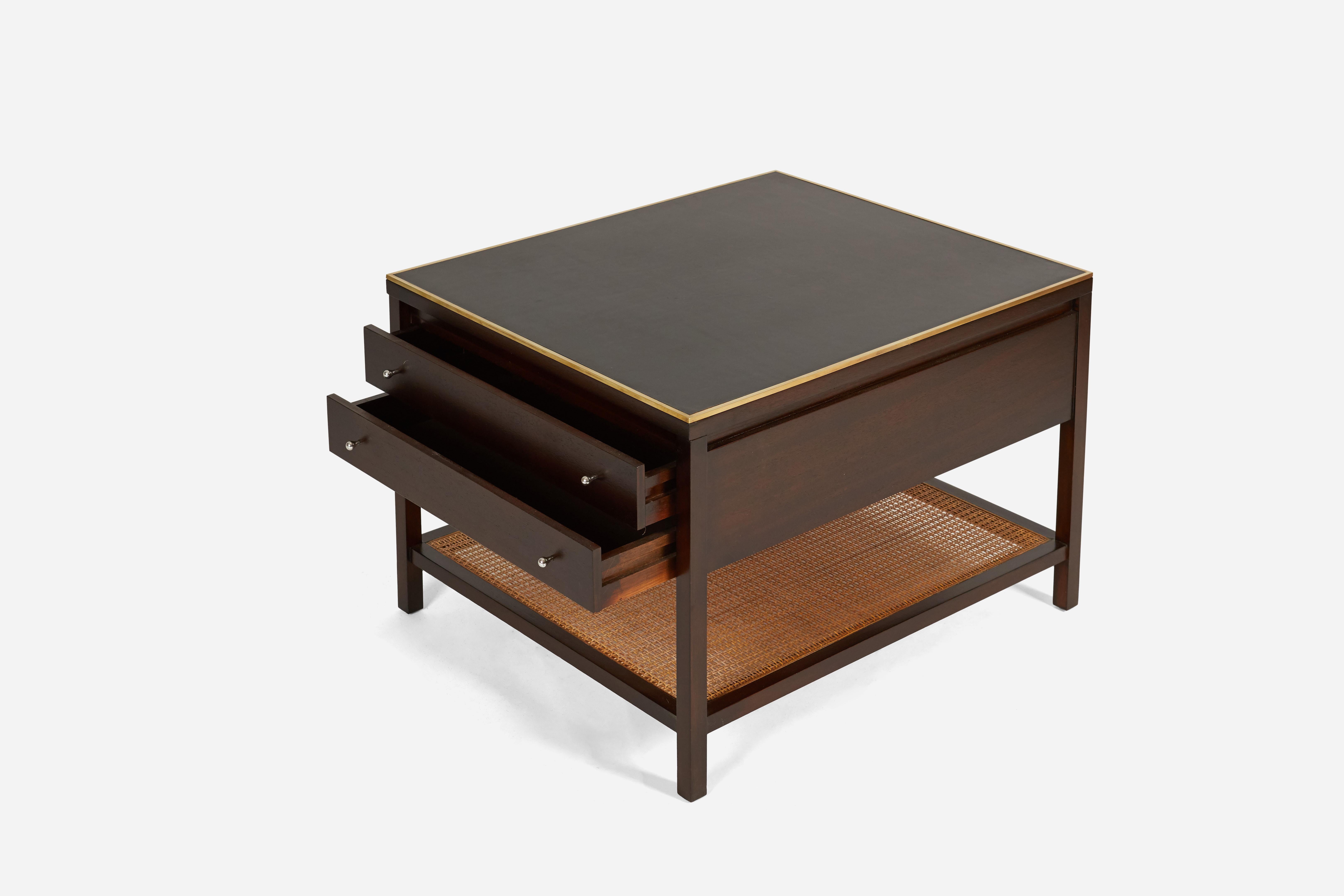 Pair of side tables designed by Paul McCobb for Calvin Furniture. Fully restored and refinished. Black leather tops with brass edging, two storage drawers, and a cane bottom shelf.  Great scale for night stands as well.