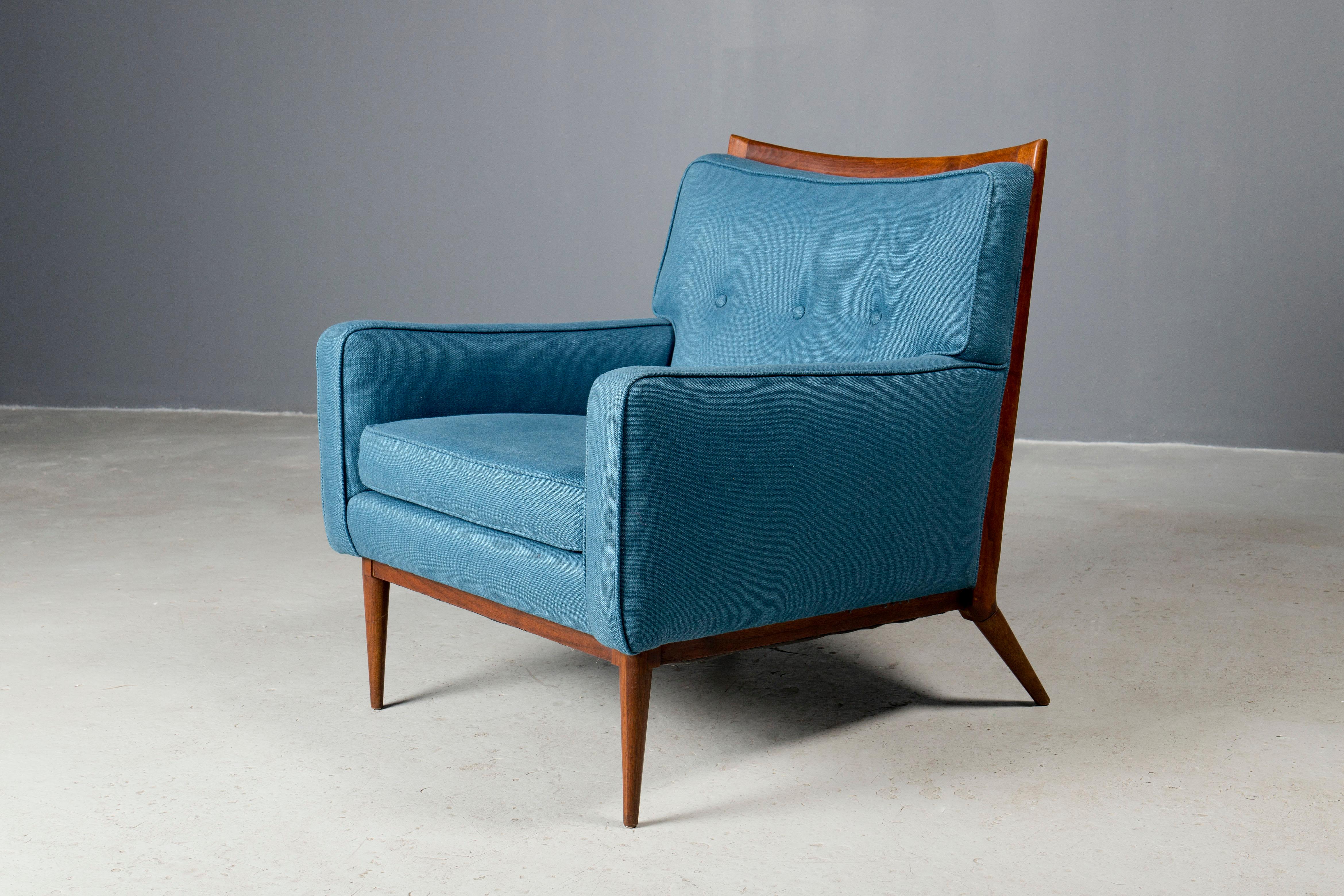 Iconic lounge chair, designed by Paul McCobb and produced by Calvin, NY, 1950s.
Frame is original in a natural finish and complimented by a beautiful blue upholstery. 
By far McCobb's most elegant design!
Available for viewing in person in my