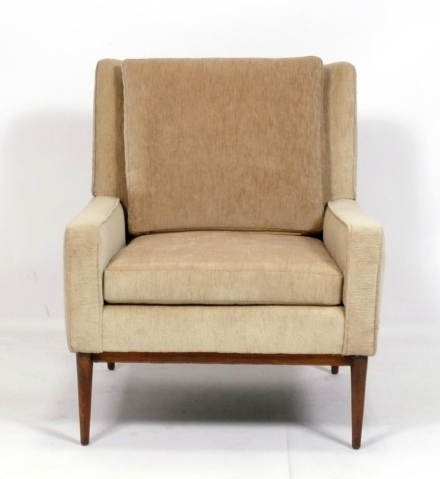 Elegant clean lined lounge chair, designed by Paul McCobb, American, circa 1950s. This chair is currently being refinished and reupholstered. You can choose the finish color, and it can be reupholstered in your fabric. Simply send us 8 yards of your