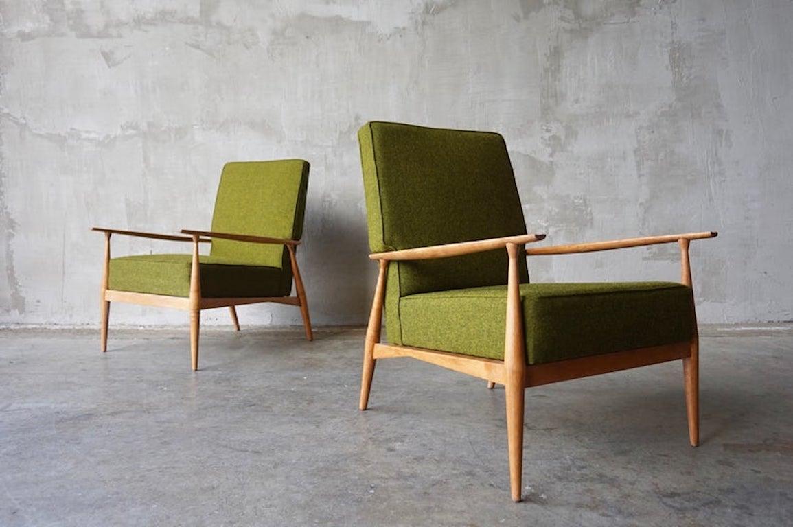 Great pair of lounge chairs designed by Paul McCobb and produced for the Planner Group line by Winchendon Furniture. 

Frames have been professionally refinished and upholstery has with updated with new old stock olive green wool fabric. 

Each