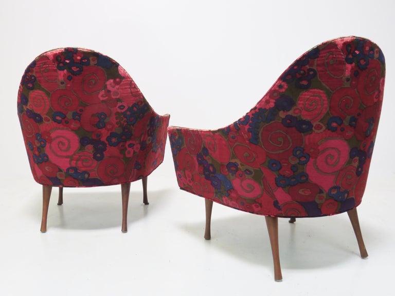 A rare pair of rounded back lounge chairs from the Symmetric Series. Retains the original Jack Larson fabric. Manufactured for just a short time in 1960 and 1961. Unmarked
Very good vintage condition.

Seat depth: 20