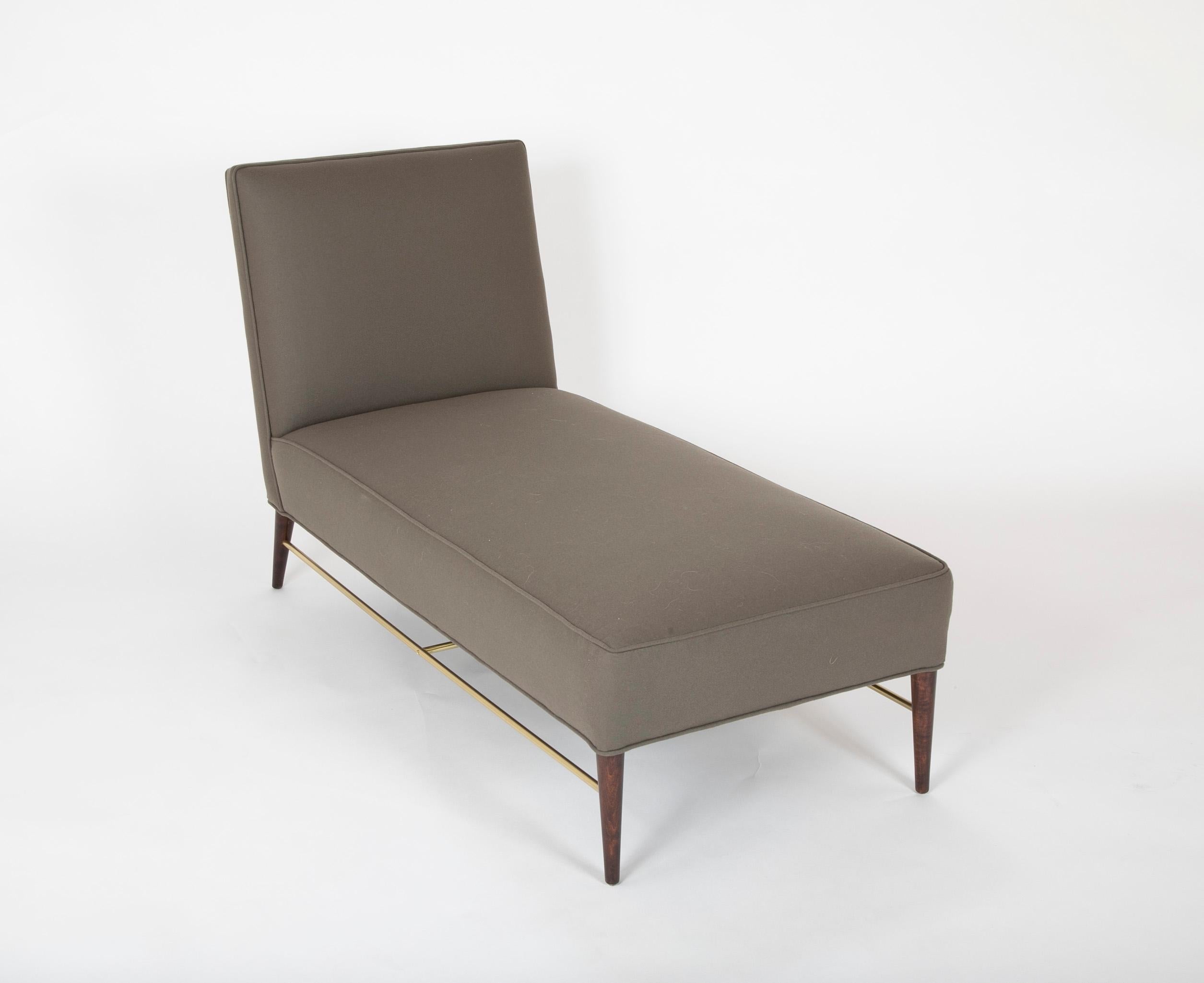 A chaise lounge, model 5018 designed by Paul McCobb for Directional, circa 1955.
upholstered in Rogers & Goffigon Fabric with brass stretcher and lacquered wood legs. 

Literature: Directional Designs: Paul McCobb, manufacturer's catalog, pg. 80.