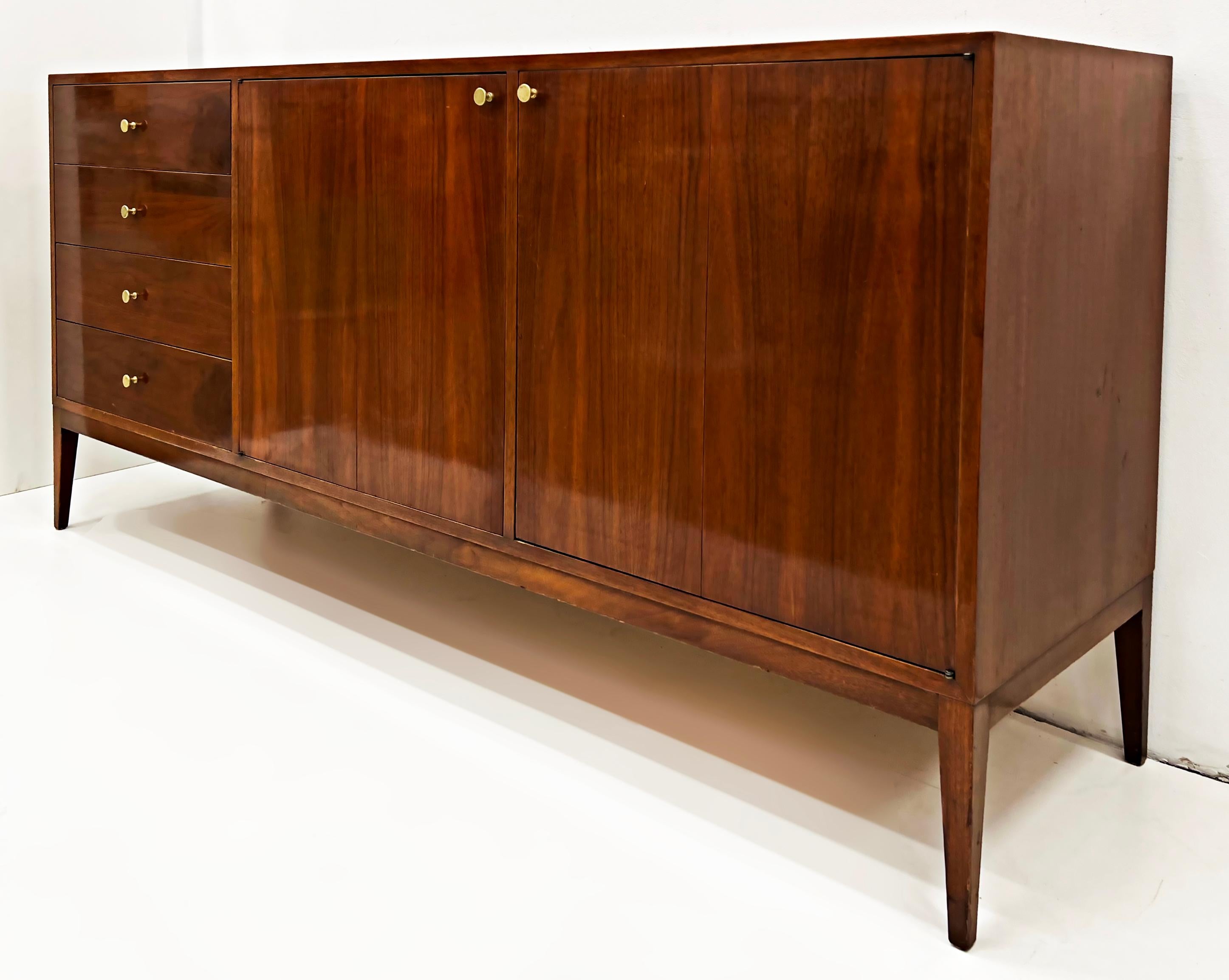 Paul McCobb Mid-Century Modern walnut 12 drawer dresser 

Offred for sale is a Mid-Century Modern Walnut 12 drawer dresser by Paul McCobb. This sleek dresser has four drawers to the left and two doors to the right which open to reveal eight