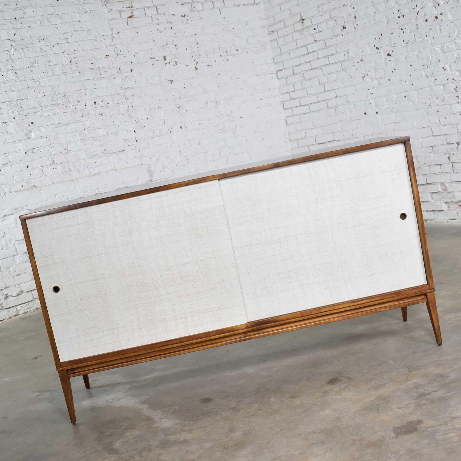 Handsome Mid-Century Modern credenza buffet cabinet #1514 designed by Paul McCobb for his Planner Group for Winchendon. It is in wonderful original vintage condition. That does not mean it is without signs of age but nothing outstanding. It has a