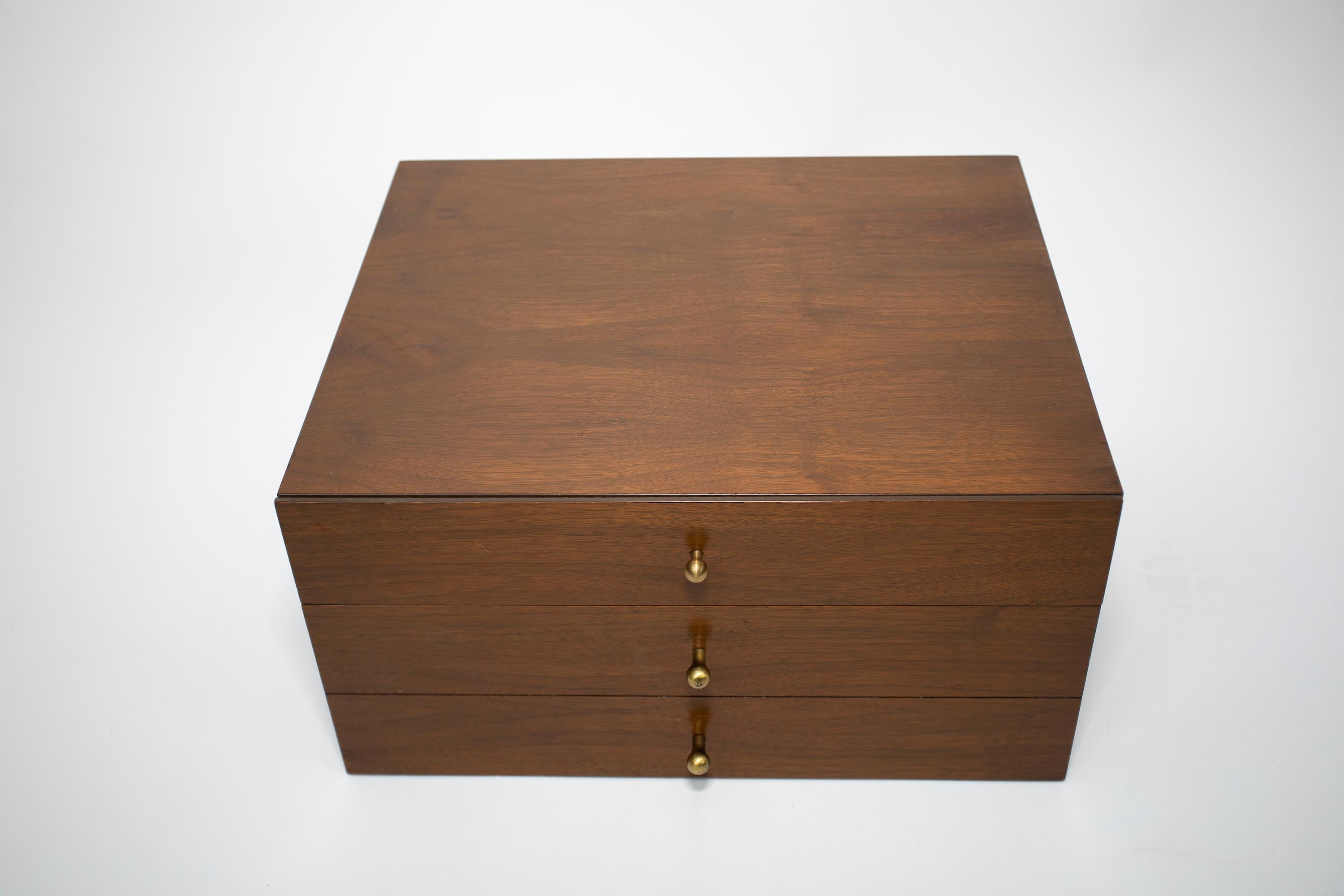 Paul McCobb 3 drawer walnut miniature cabinet.
Tear drop brass pulls.
 