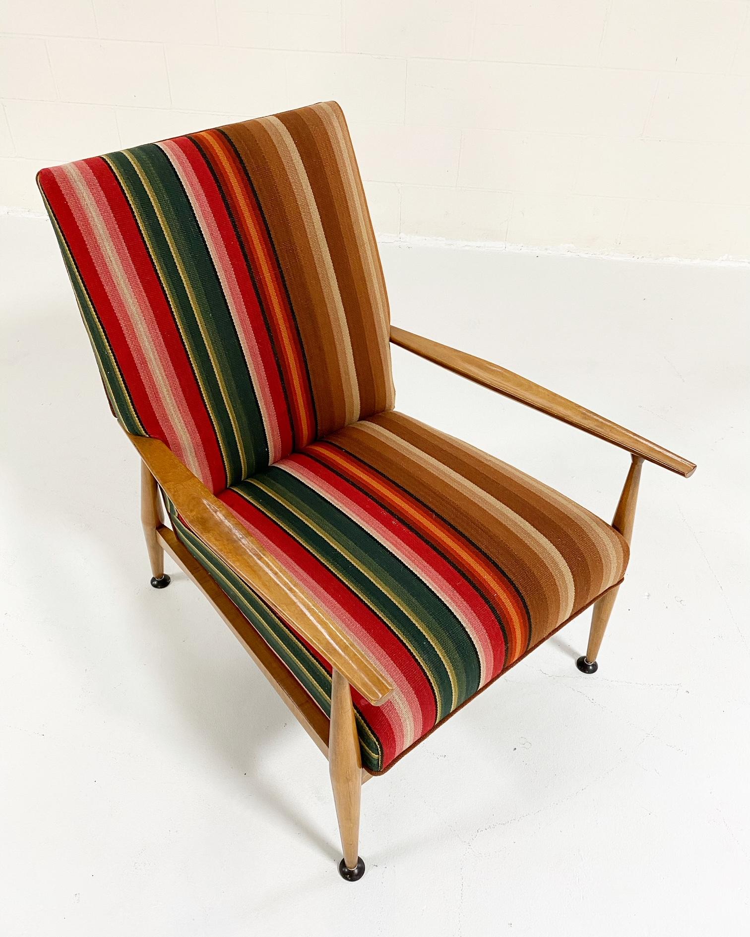 Paul McCobb's modern take on traditional pieces makes him a favorite among American midcentury designers. Completely restored and masterfully reupholstered in a cool vintage Guatemalan fabric that complements the beautifully toned wood frame, we