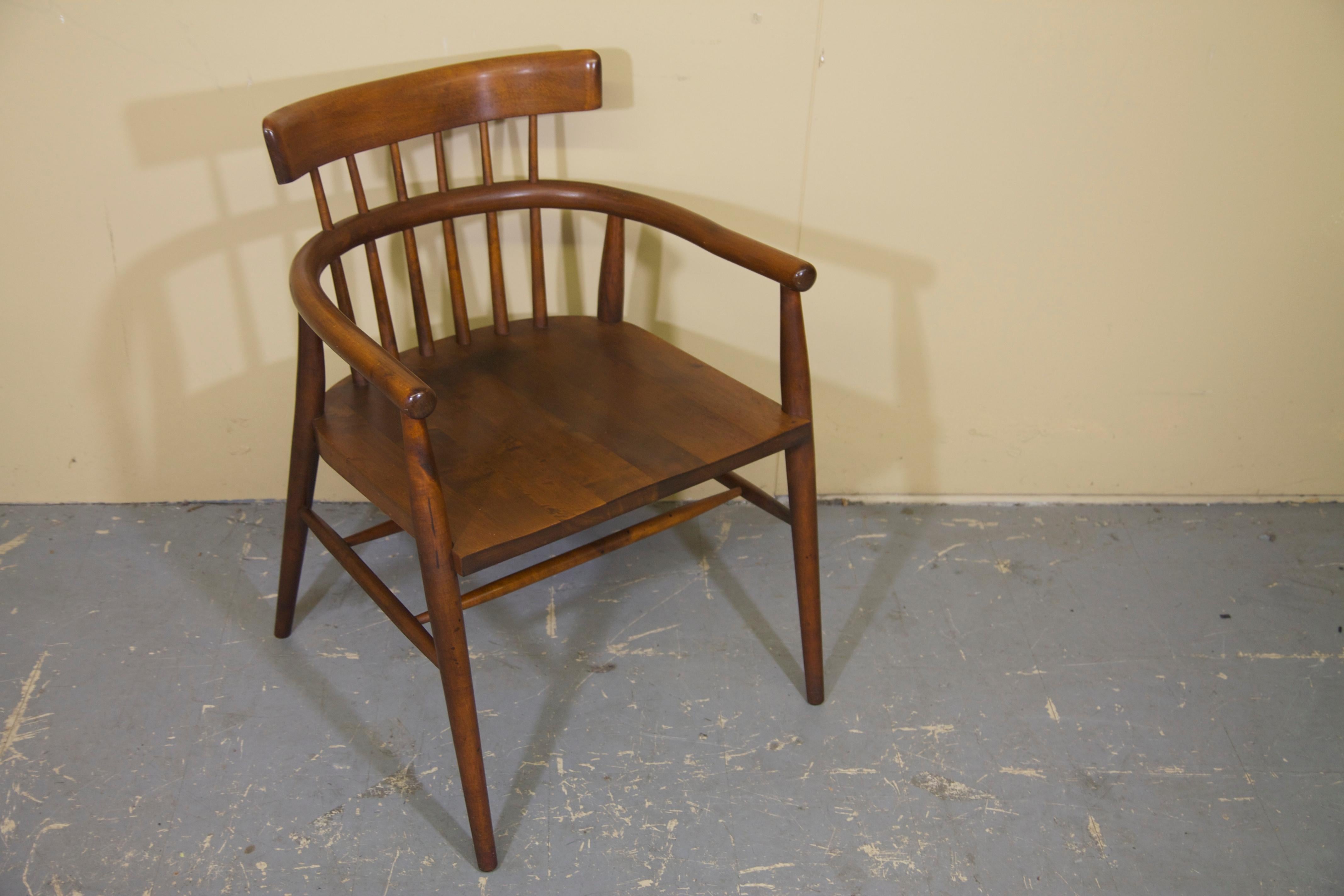 Rarely seen armchair designed by Paul McCobb in the 1950s. Chair is constructed out of maple with a darker finish on it. The chair is in nice vintage condition with some marks in the original finish. There are no structural issues.