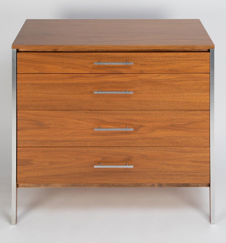 Pair of 4 drawer bedside chests in walnut with aluminum pulls and trim by Paul McCobb for Calvin Furniture, American, 1960's.