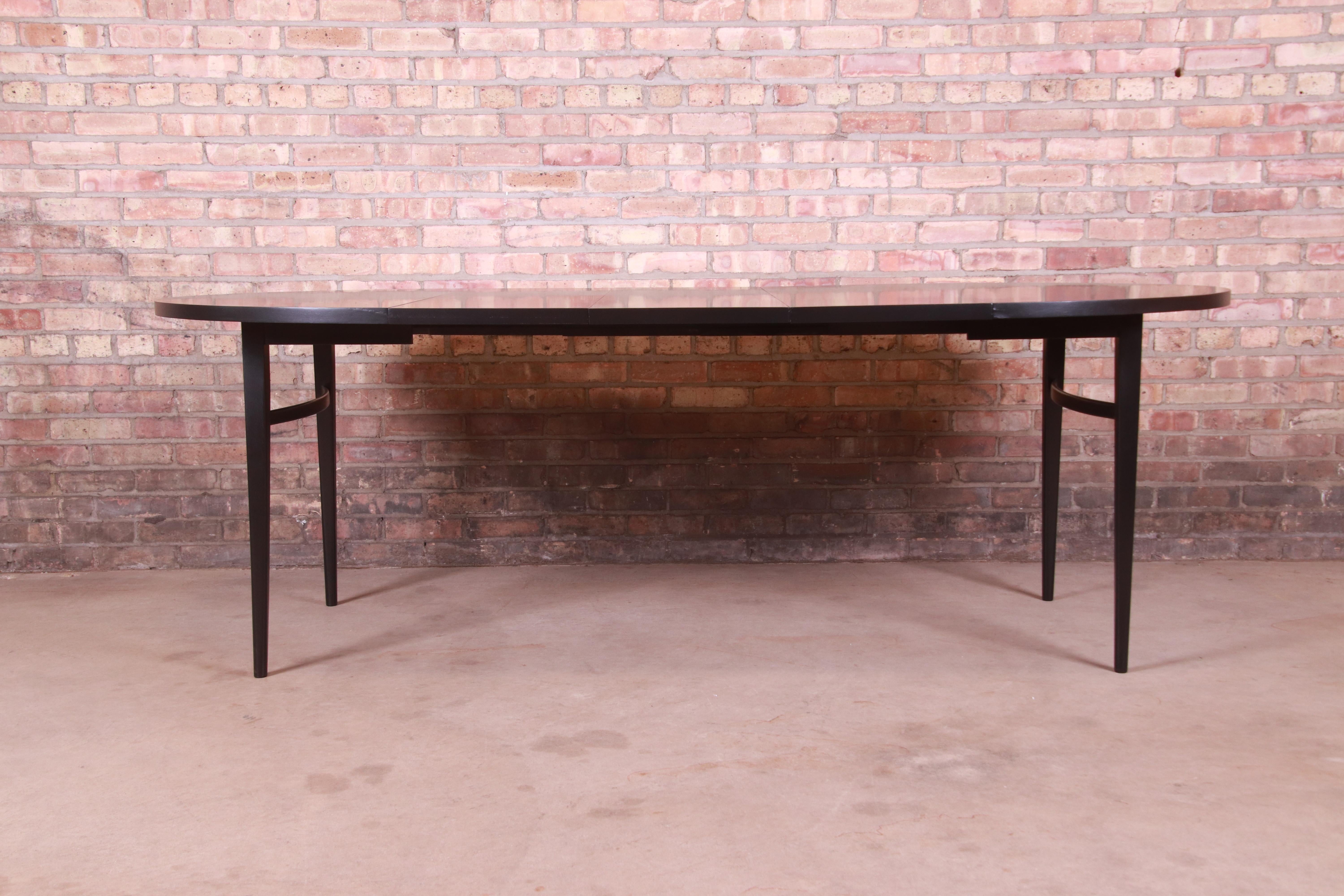 An exceptional Mid-Century Modern black lacquered extension dining table

By Paul McCobb for Winchendon Furniture, 