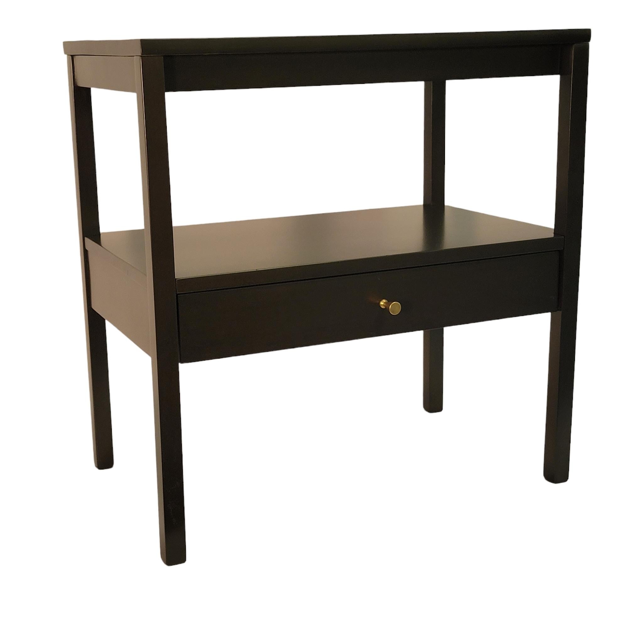 A very special pair of iconic Paul McCobb end tables/night stands. These mid century modern pieces are constructed in maple and lacquered in blackened brown. The hardware is original. Stylish and highly utilitarian, these end tables/night stands are