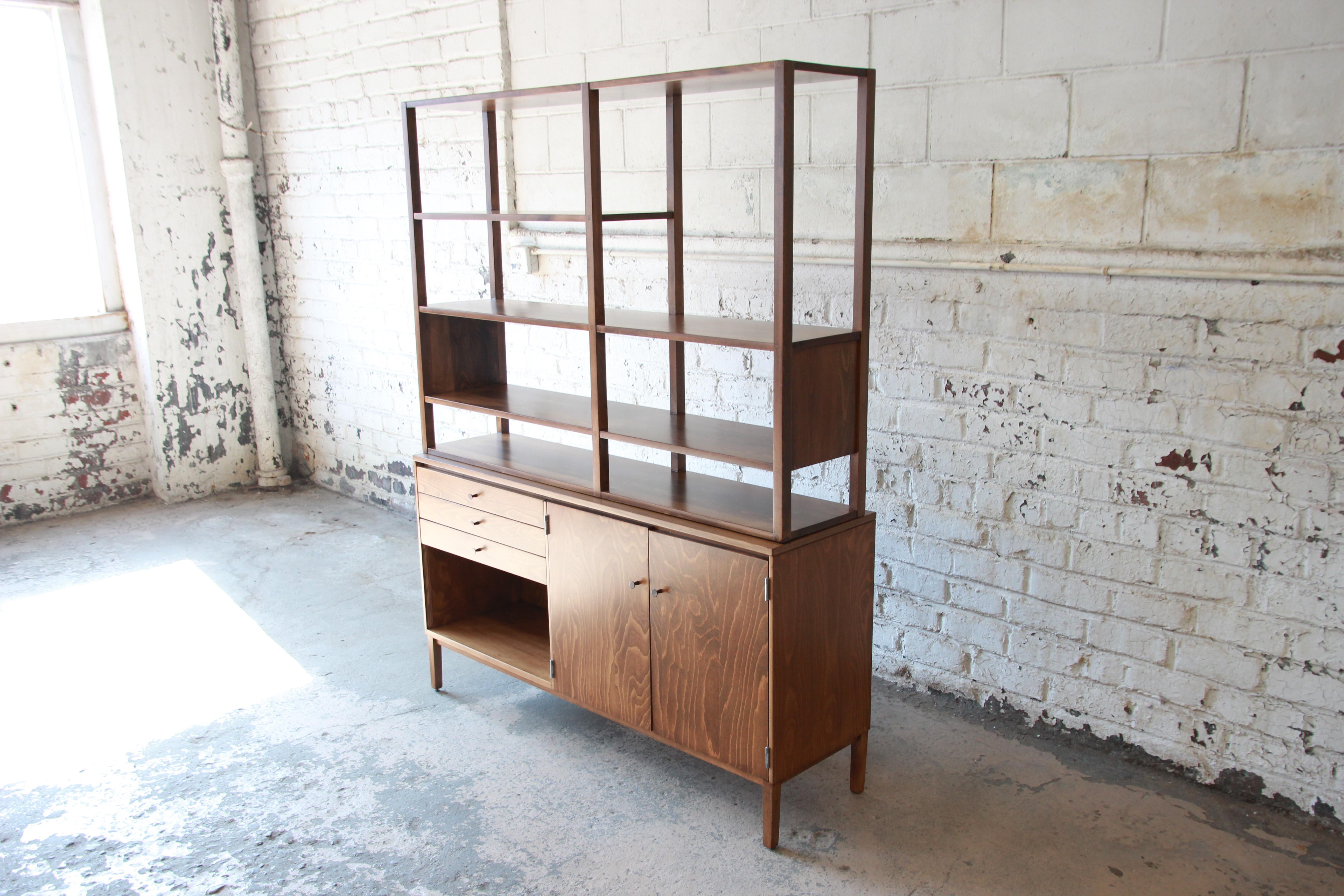 A rare and exceptional Mid-Century Modern wall unit or room divider designed by Paul McCobb for his Perimeter Group line for Winchendon Furniture. This piece features gorgeous wood grain and solid birch construction. It offers ample room for storage