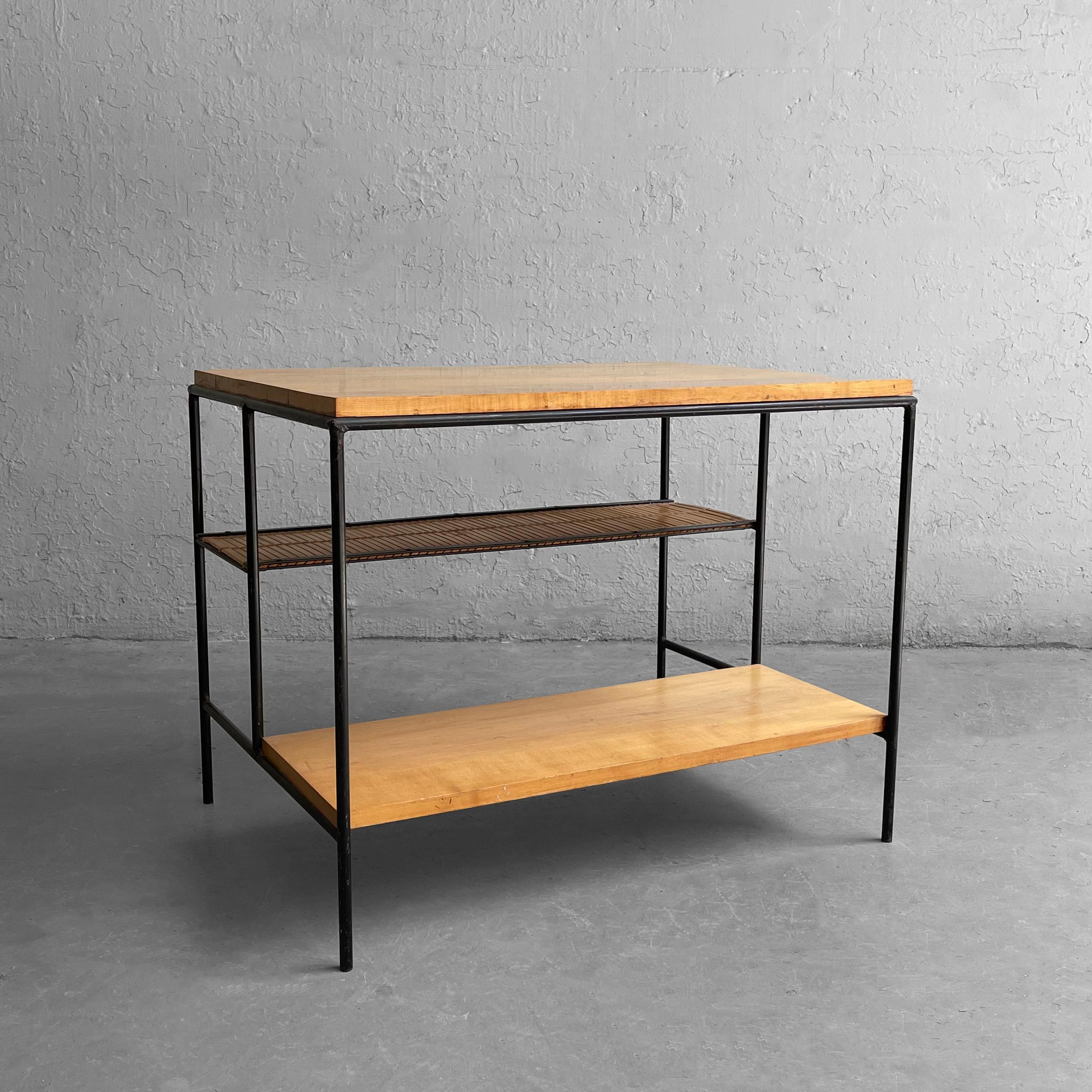 Minimal, mid century modern, side table by Paul McCobb for Planner Group features a wrought iron frame with graduated tiers of maple and slat maple. The lower tier is 6.5 inches height and 10 inches deep and the middle tier is 14 inches height and
