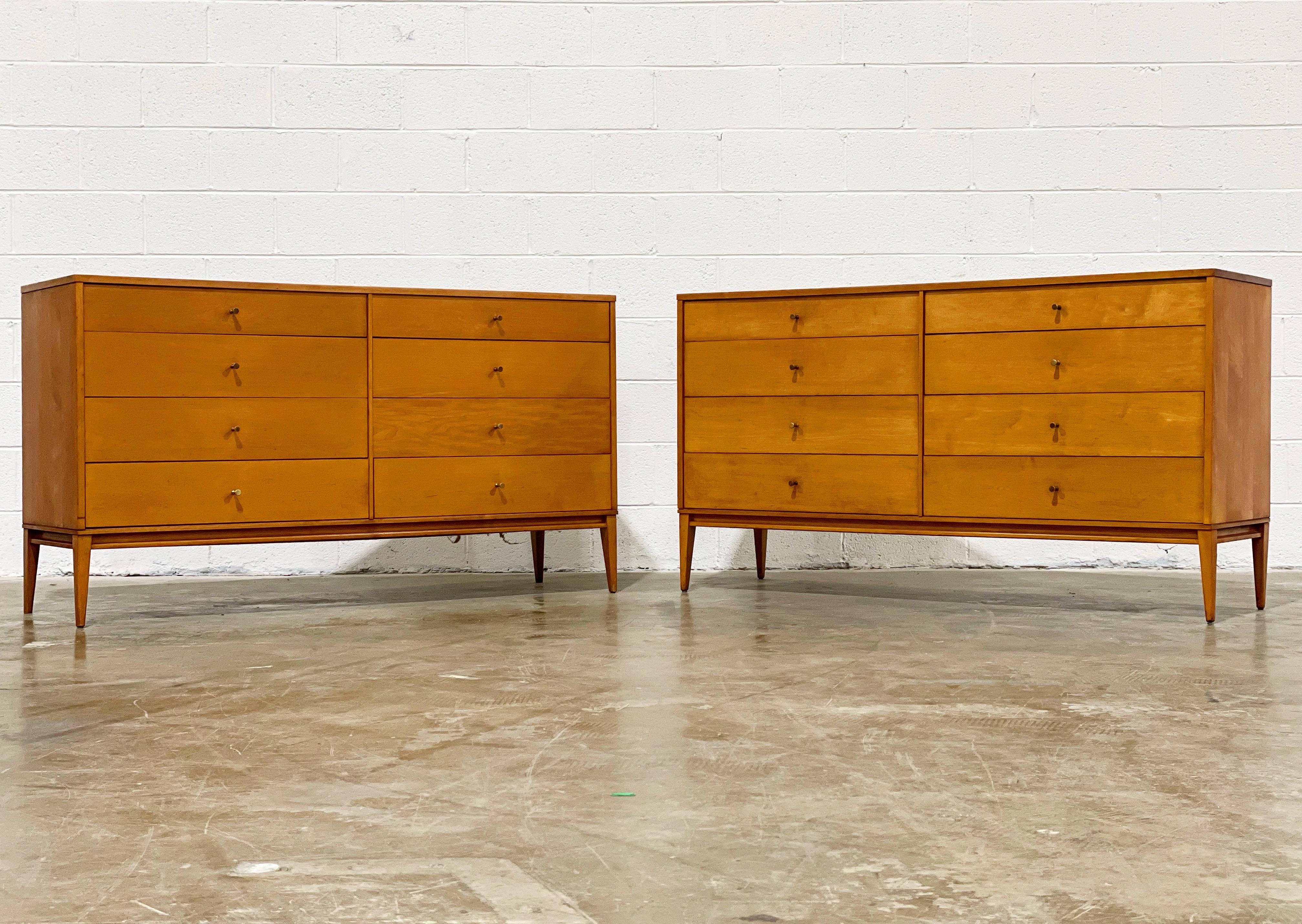 Pair of Mid-Century Modern Paul McCobb 8-drawer dressers - Planner Group model #1507 by Winchedon. Scarce matching pair of stellar case pieces - eight drawers, solid maple, original brass cone pulls. Solid maple original base. Original foil label.