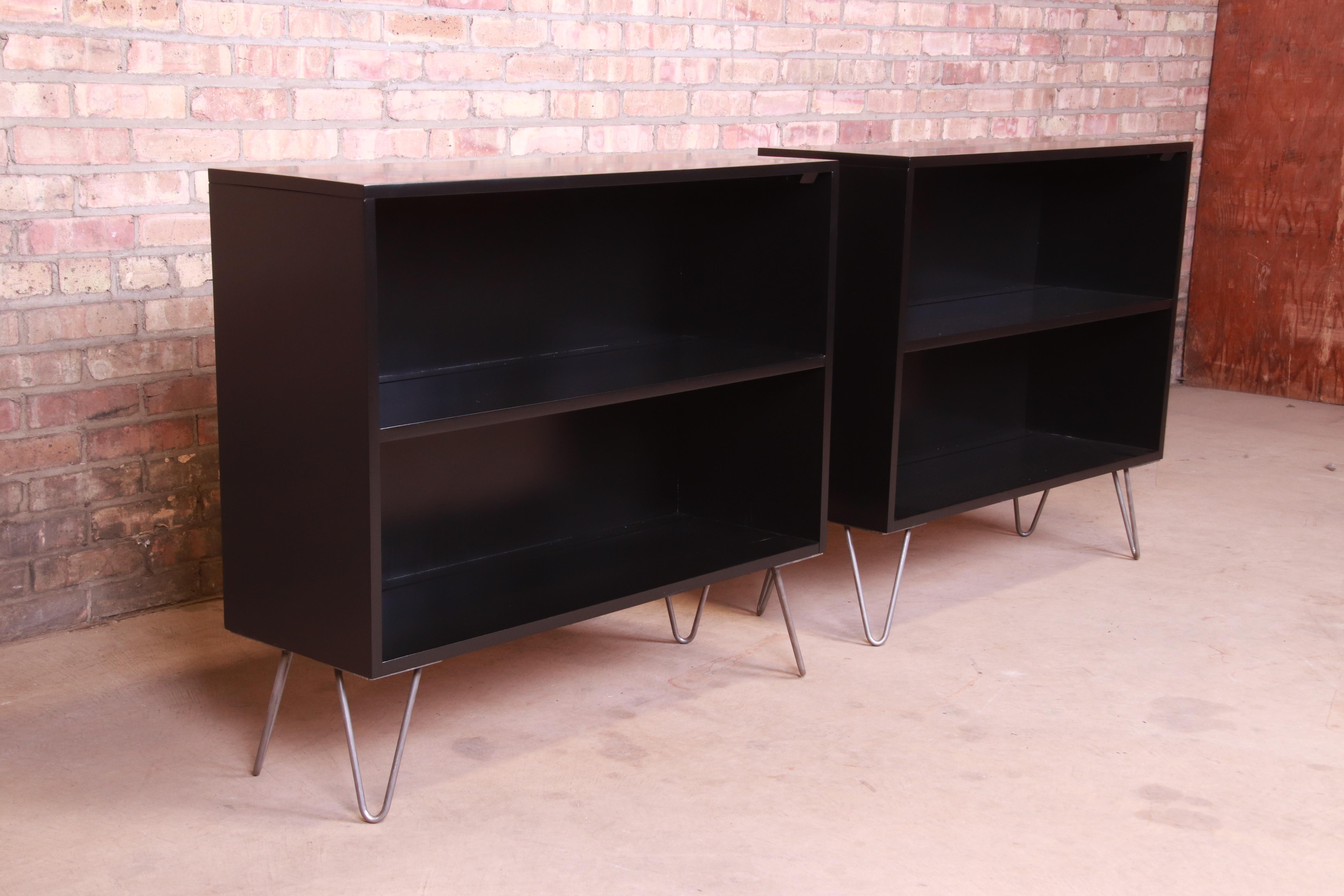 An exceptional pair of Mid-Century Modern black lacquered solid birch bookcases on hairpin legs

By Paul McCobb for Winchendon Furniture 