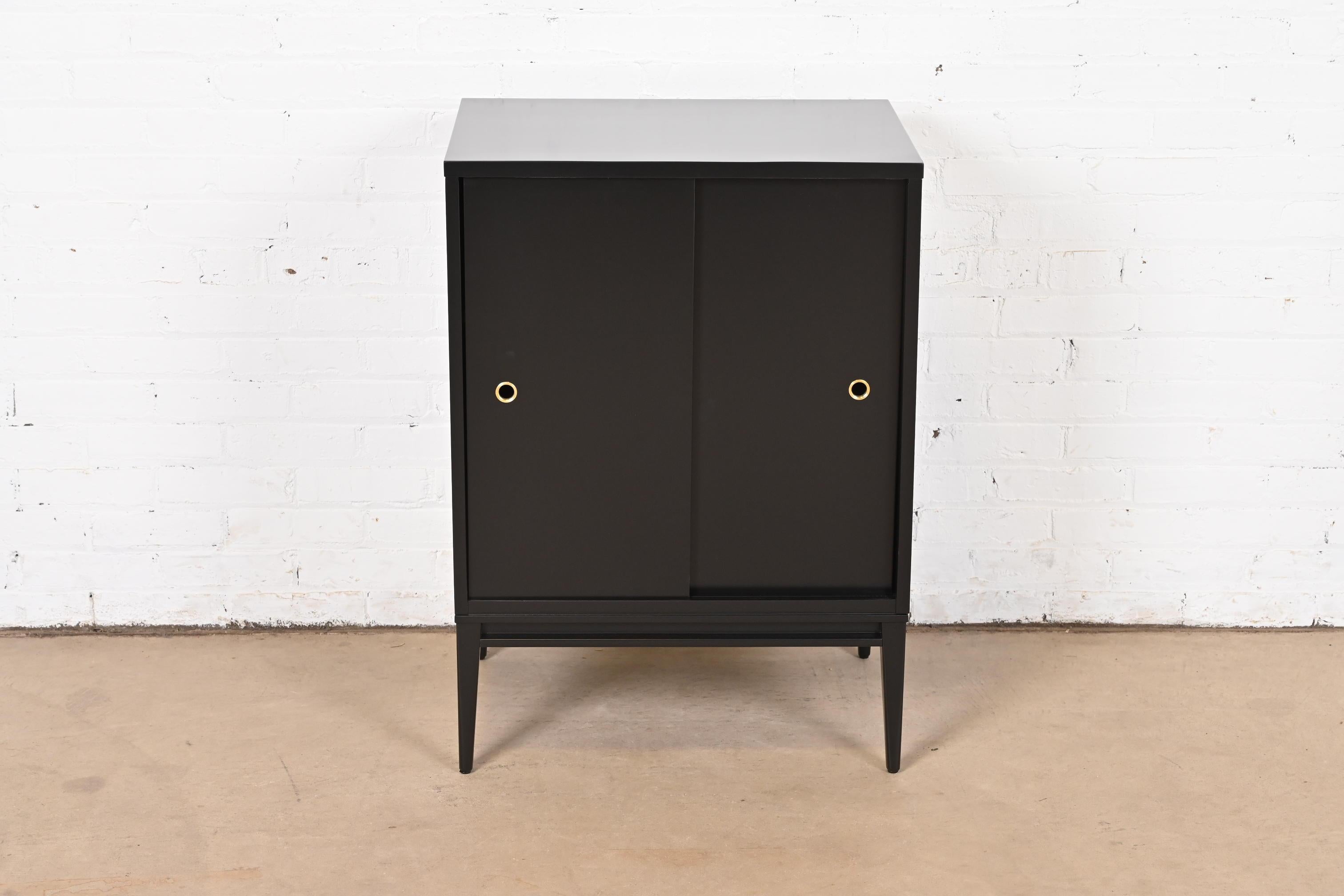 A gorgeous Mid-Century Modern black lacquered solid maple record cabinet or bar cabinet with sliding doors

By Paul McCobb for Winchendon Furniture, 