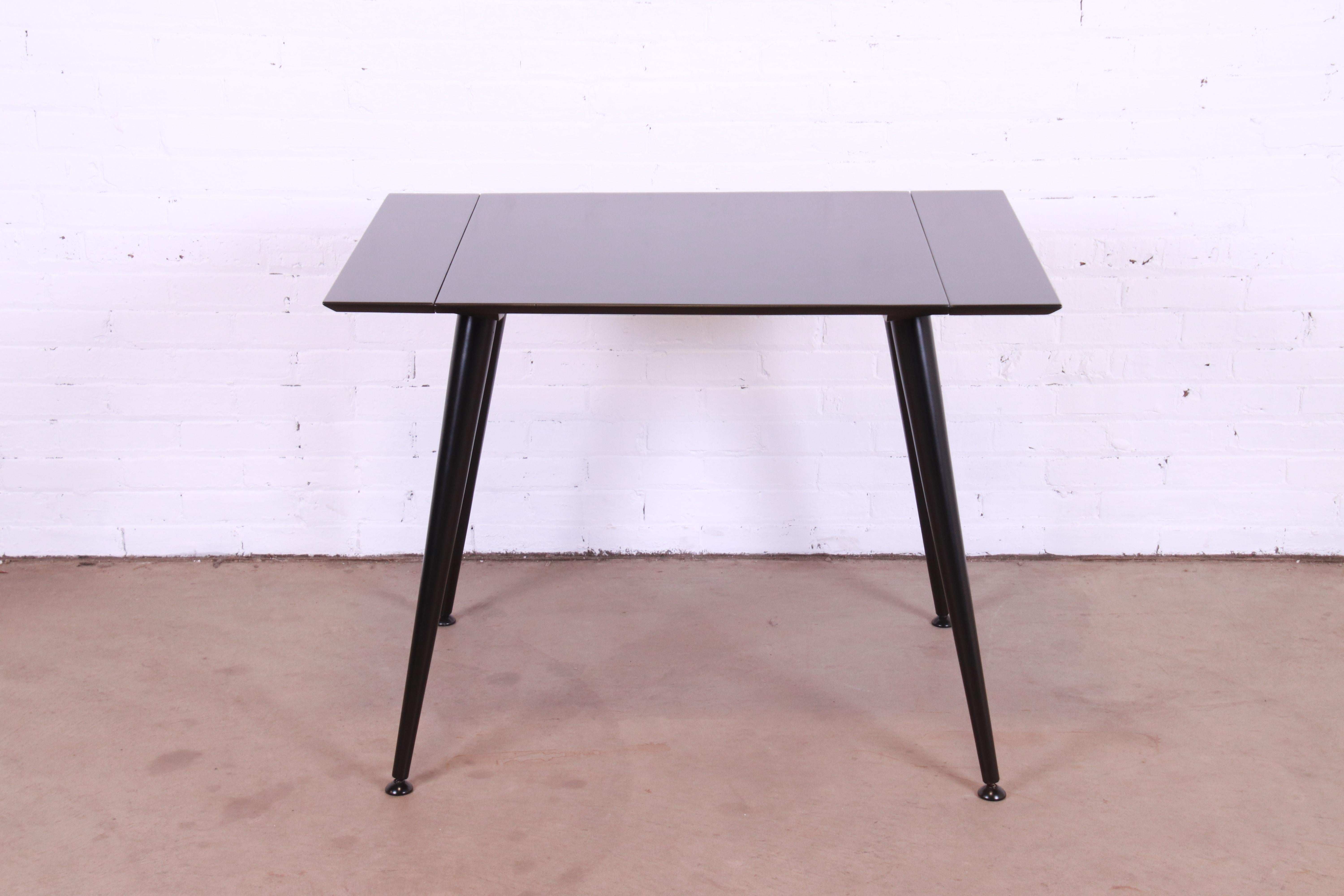A sleek and stylish Mid-Century Modern extension dinette table or game table

By Paul McCobb for Winchendon Furniture, 