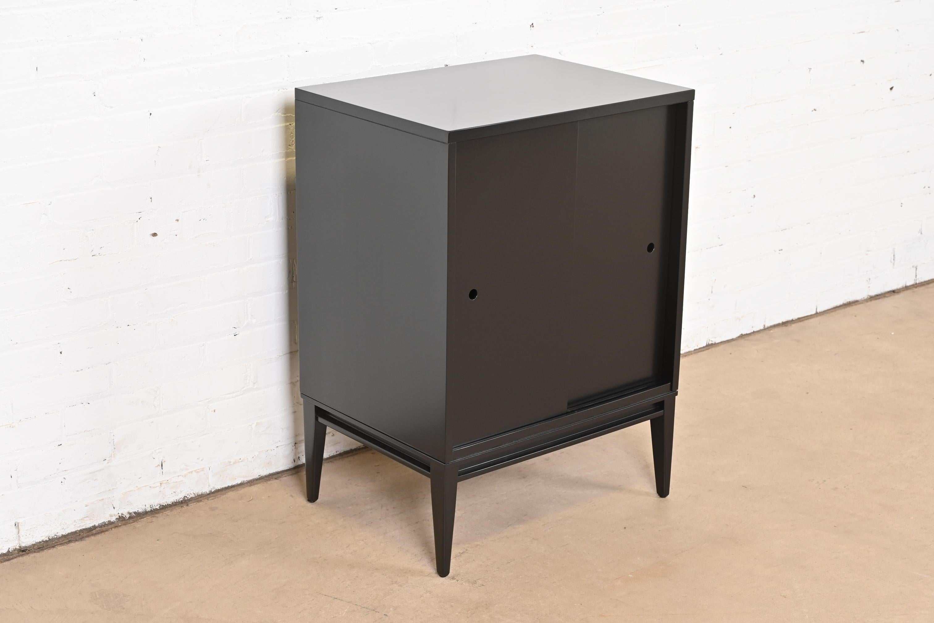 Mid-20th Century Paul McCobb Planner Group Black Lacquered Record Cabinet With Sliding Doors For Sale