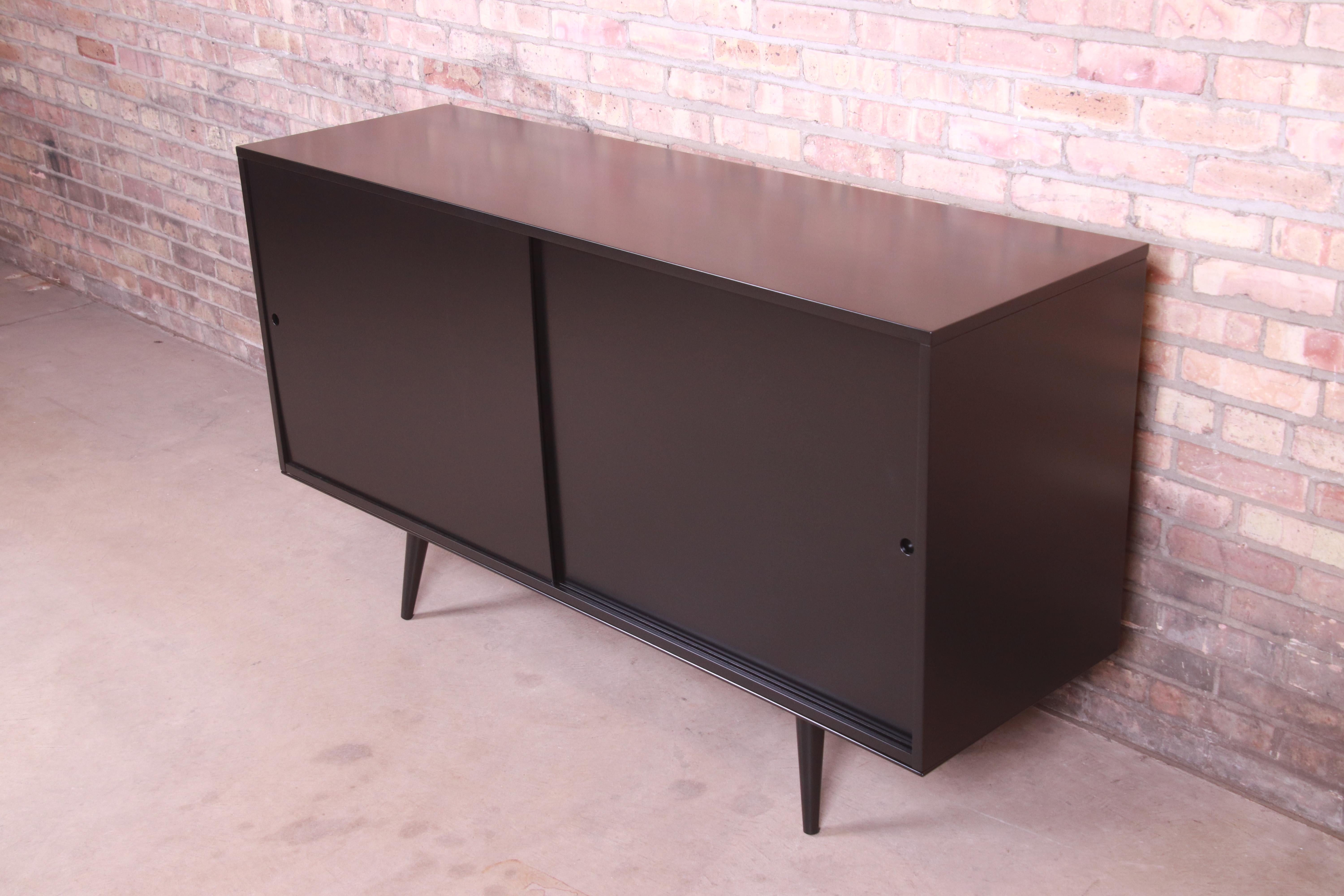 An exceptional Minimalist Mid-Century Modern sliding door sideboard, credenza, or bar cabinet

By Paul McCobb for Winchendon Furniture 