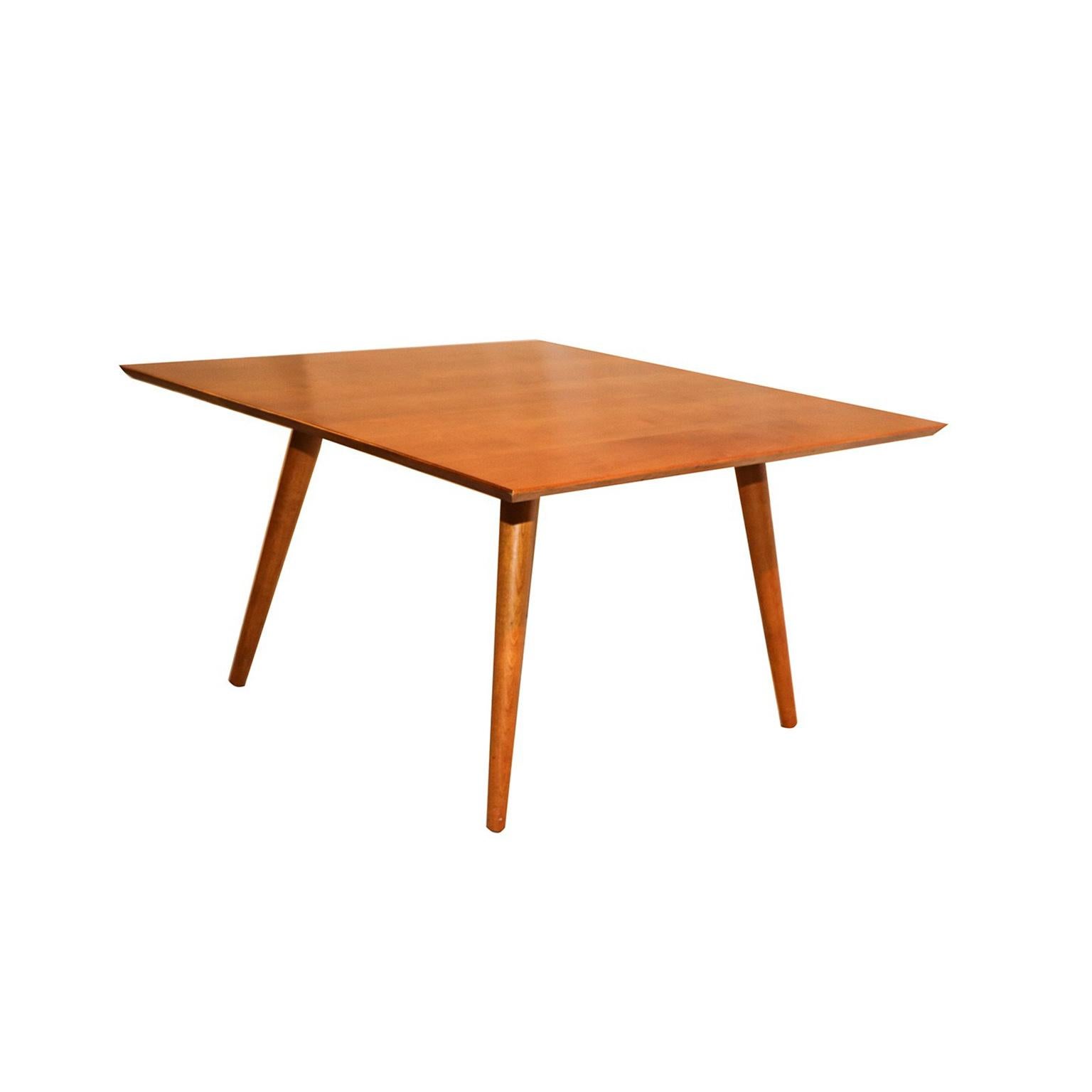 Original, handsome, Classic, midcentury coffee table designed by Paul McCobb for the Planner Group collection. Square table in maple with gently tapered legs and a slender profile. The top has the appearance of floating. Solid maple construction.