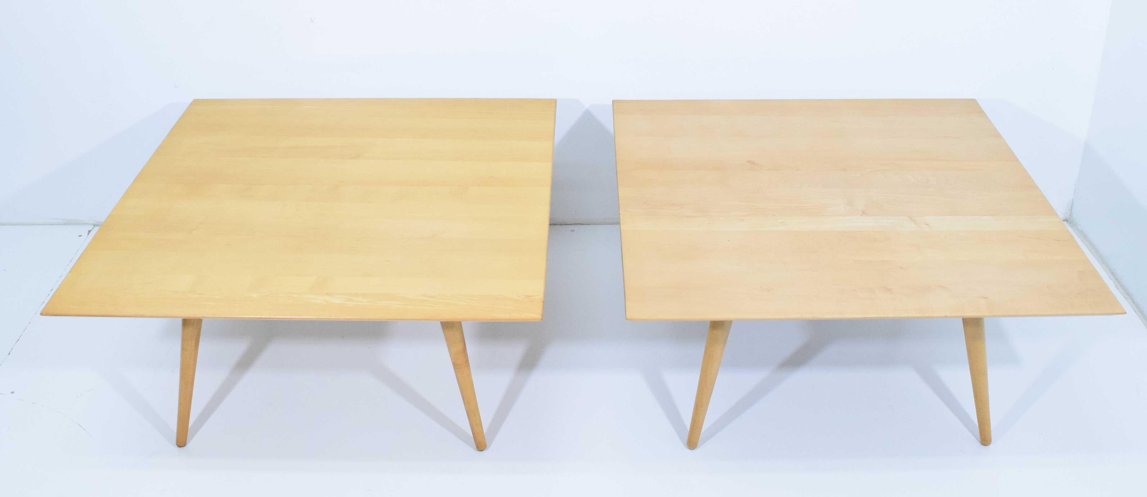 We can sell individually. Pair of tables in maple by Paul McCobb. Solid maple top with conical legs.