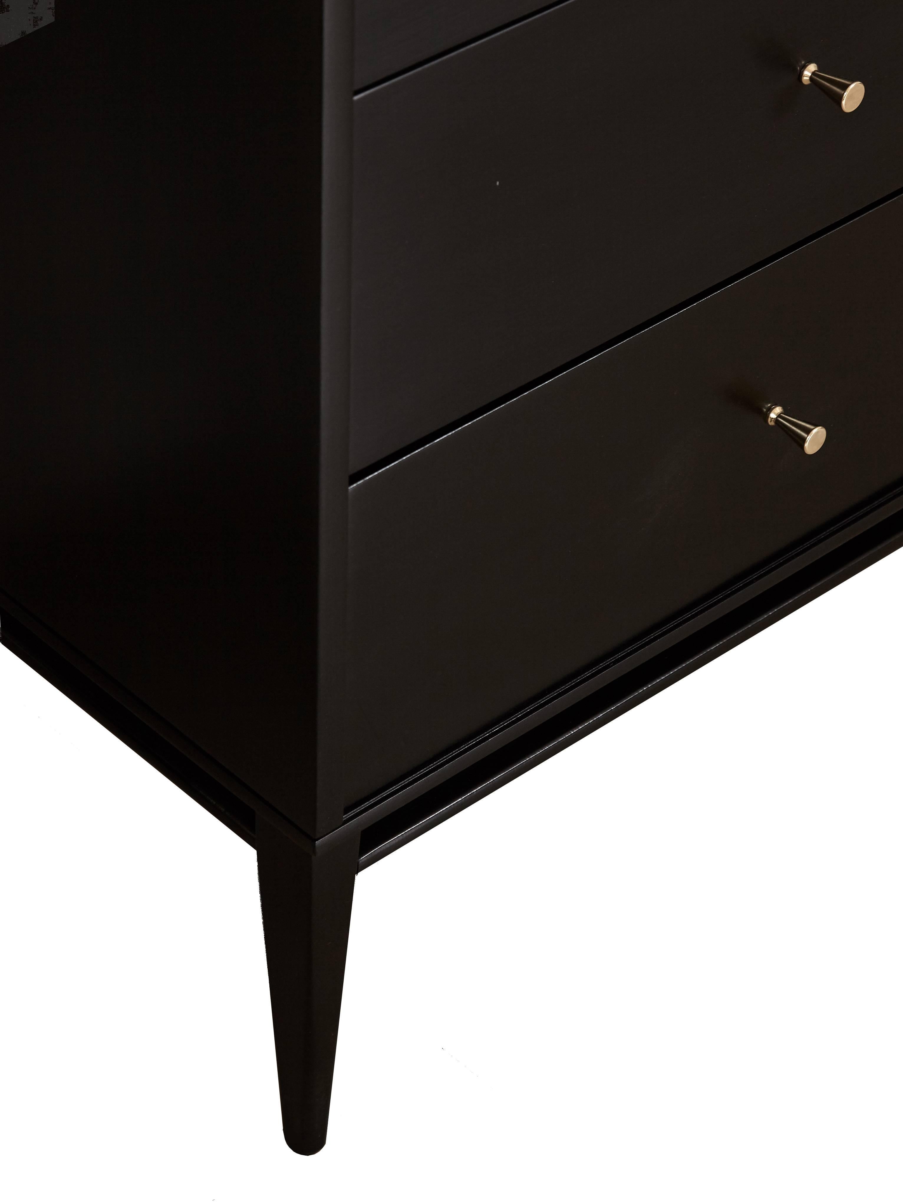 Paul McCobb Planner Group console featuring three drawers and two sliding doors with adjustable shelving interior. Fully restored in black lacquer piano finish.
