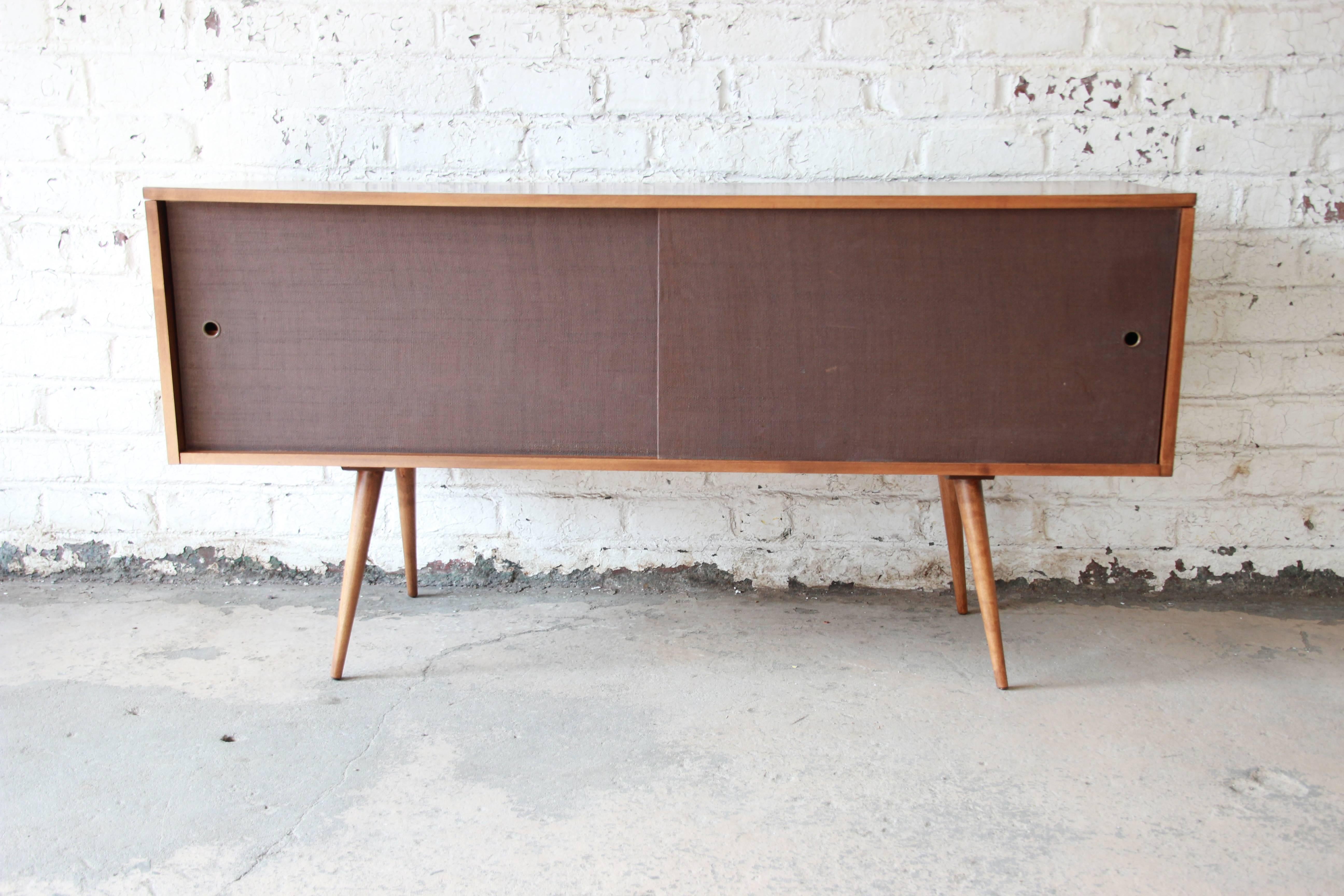 Offering an exceptional Mid-Century Modern credenza or record cabinet designed by Paul McCobb for his 