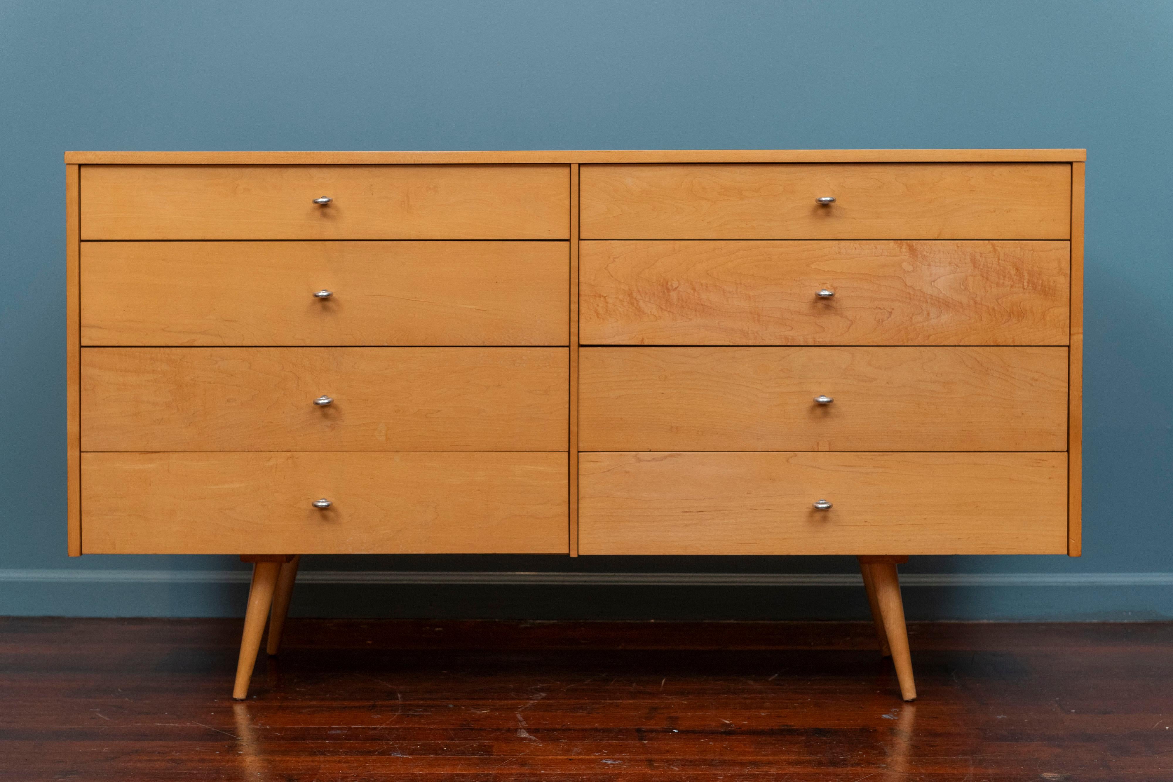 Paul McCobb design dresser for his debut Planner Group series for Winchendon, Mass. High quality construction using solid maple wood featuring eight drawers with aluminum o-ring pulls. In very good original condition, labeled. 
Matching  three