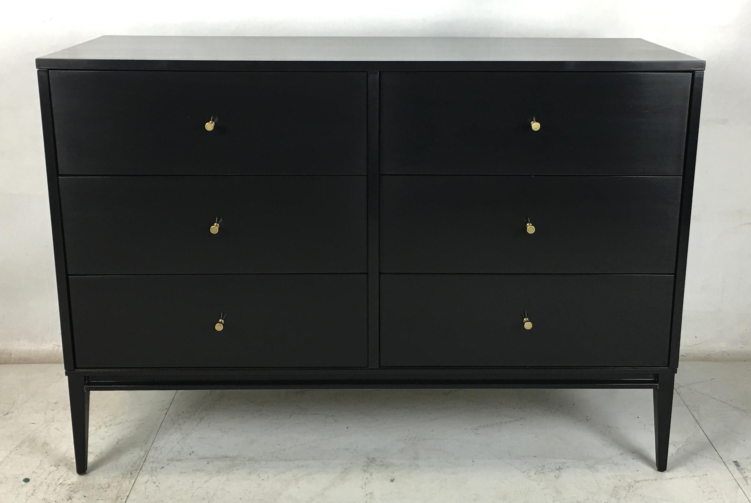 Painstakingly restored six-drawer dresser in hand-rubber black lacquer by Paul McCobb for his Planner Group collection of case goods. The dresser has been restored from the ground up and the hardware has been polished and lacquered by hand,