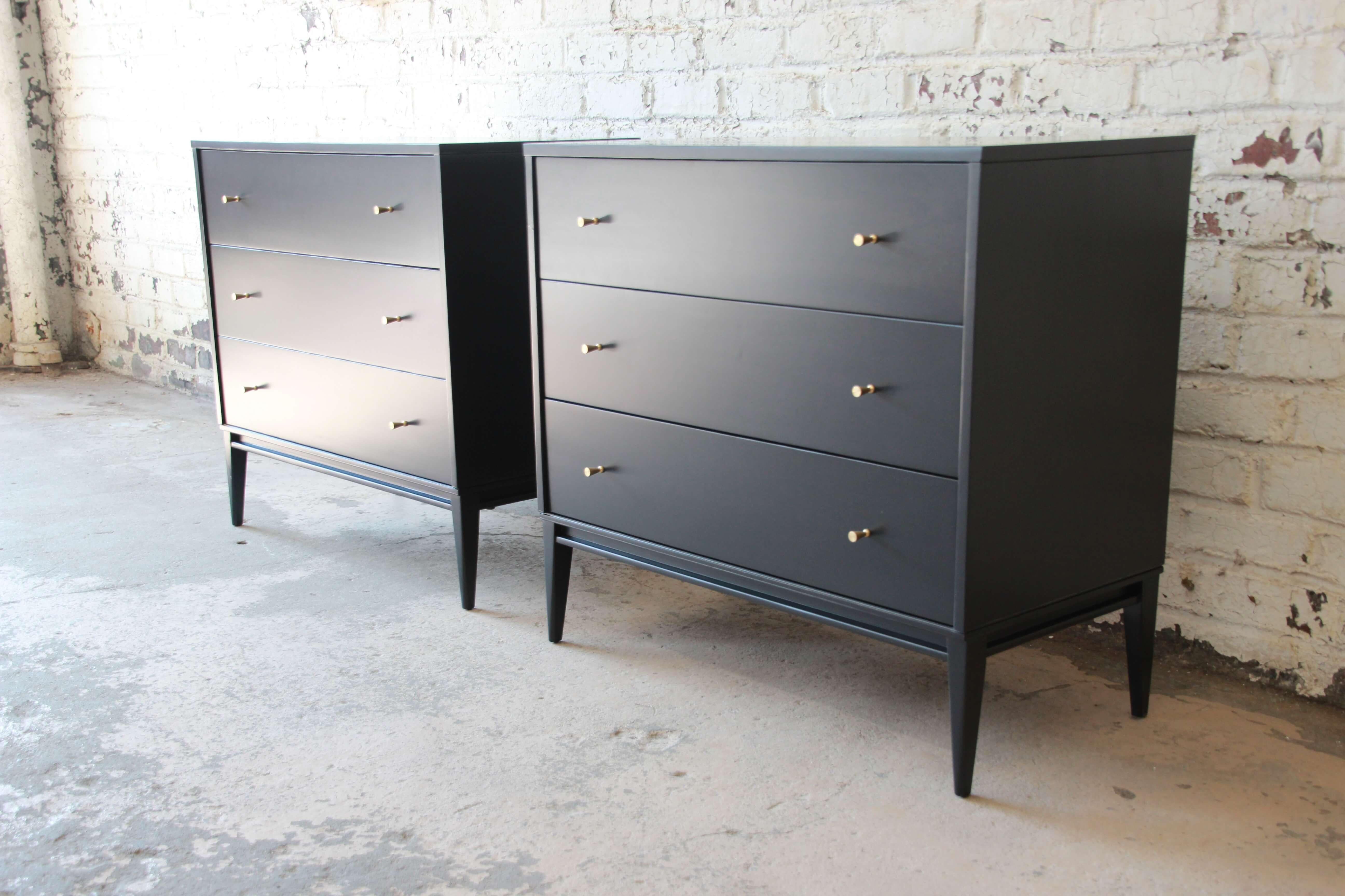 Offering an outstanding pair of Paul McCobb Planner Group three-drawer chests or nightstands. The chests are newly refinished with polished brass pulls. Each chest has three drawers that offer ample storage in this simplistic and iconic design seen