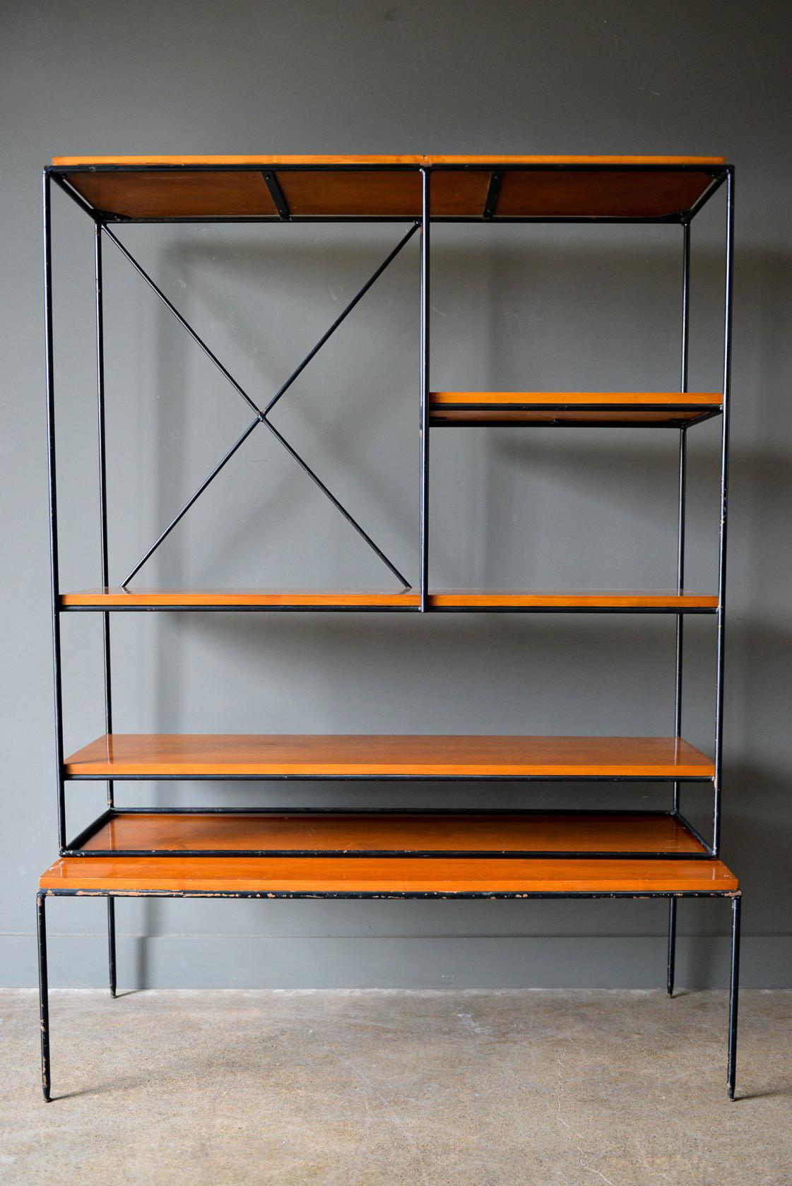 Early production Paul McCobb Planner Group iron and maple shelving unit or room divider, circa 1950. Original iron frame and feet, maple shelves with solid wrought iron frame. Two pieces, top is separate from bottom table and floats on base.