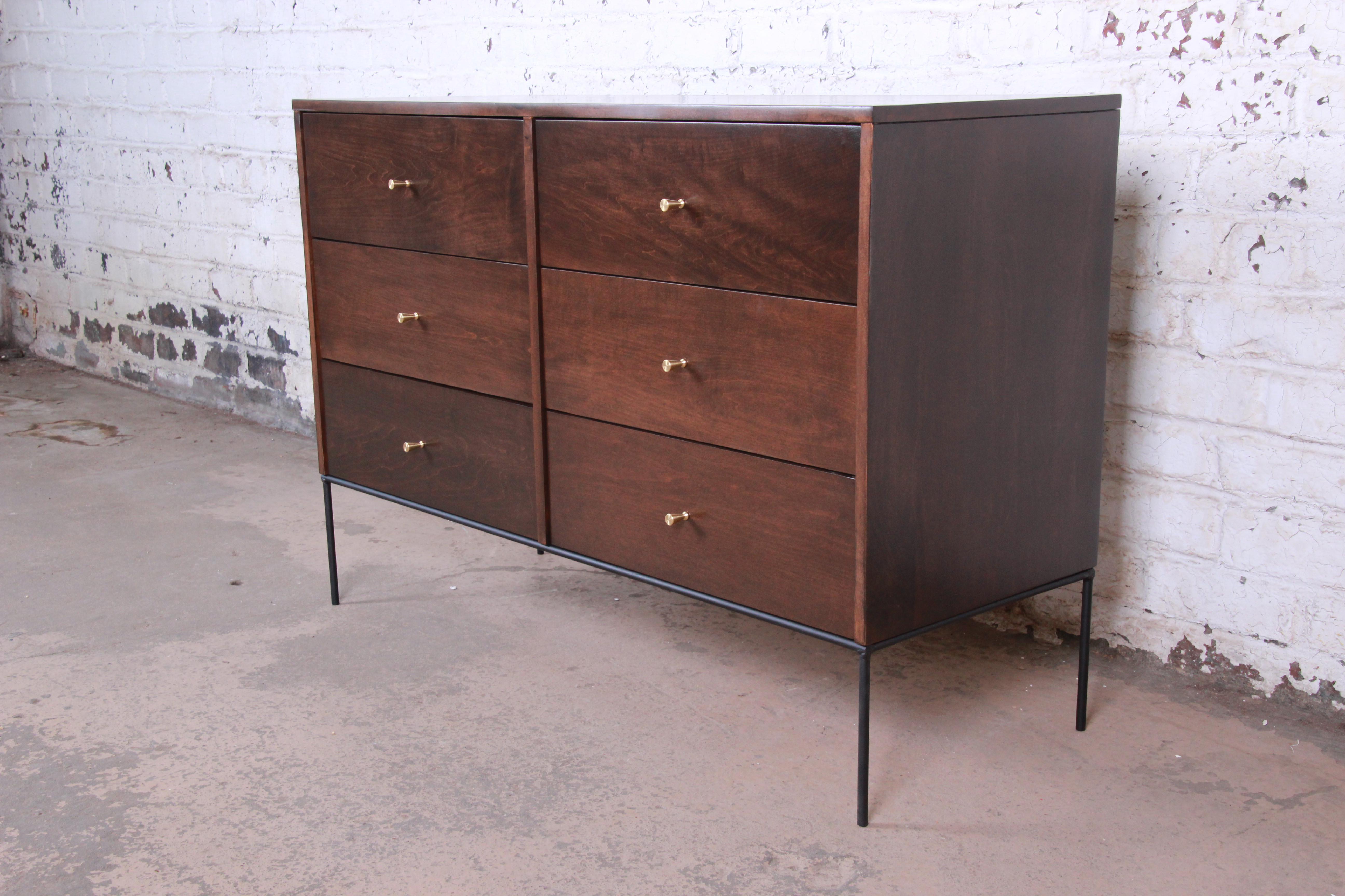 An exceptional Mid-Century Modern six-drawer dresser or credenza from the Planner Group line designed by Paul McCobb for Winchendon Furniture. The dresser features solid maple construction with stunning wood grain. It offers ample storage, with six
