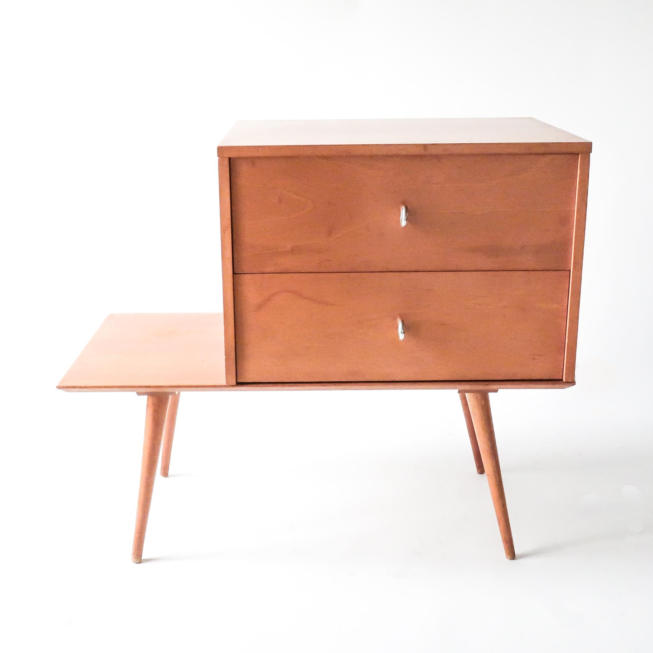 Paul McCobb two-drawer chest on a low table from his Planner Group for Winchendon, his most popular line from the 1950s. The components from this line are interchangeable--the chest section can sit on either the right or left side of the base. In