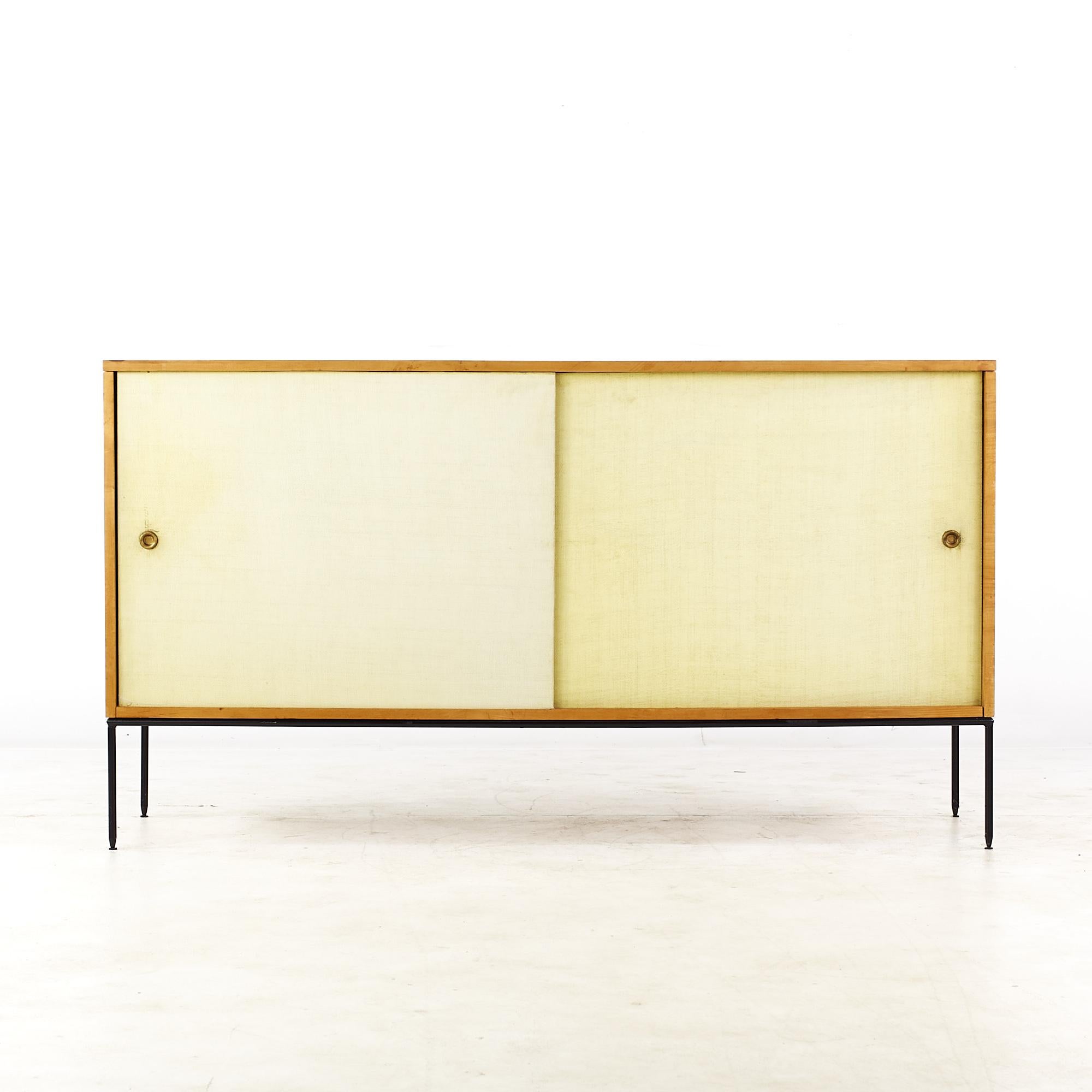 Paul McCobb Planner group mid century 1514 iron base white cloth door credenza

This credenza measures: 60 wide x 18 deep x 33 inches high

All pieces of furniture can be had in what we call restored vintage condition. That means the piece is